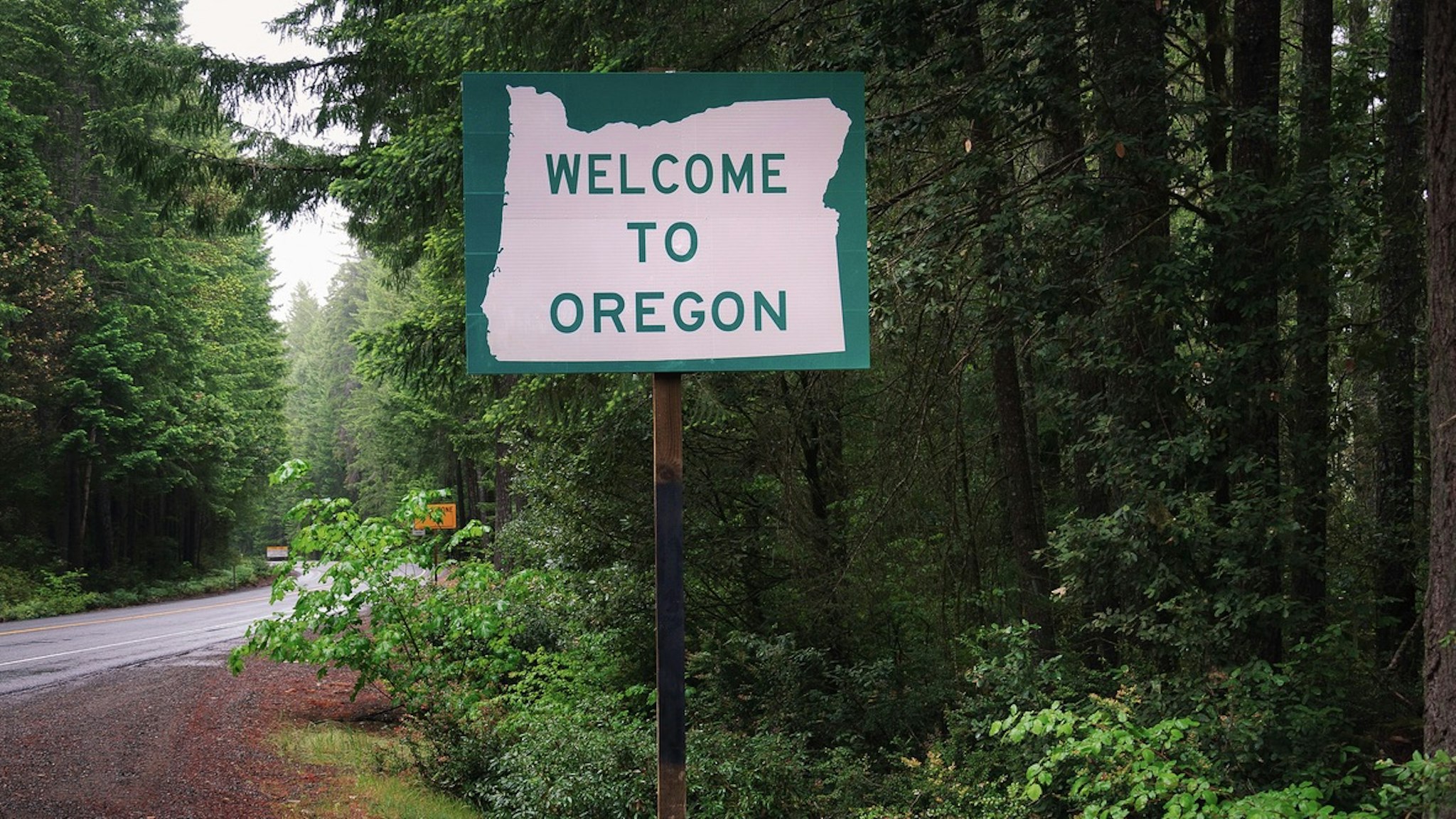 Welcome to Oregon State Sign - stock photo Welcome to Oregon State Sign on US-199 also called the Redwood Highway miroslav_1 via Getty Images