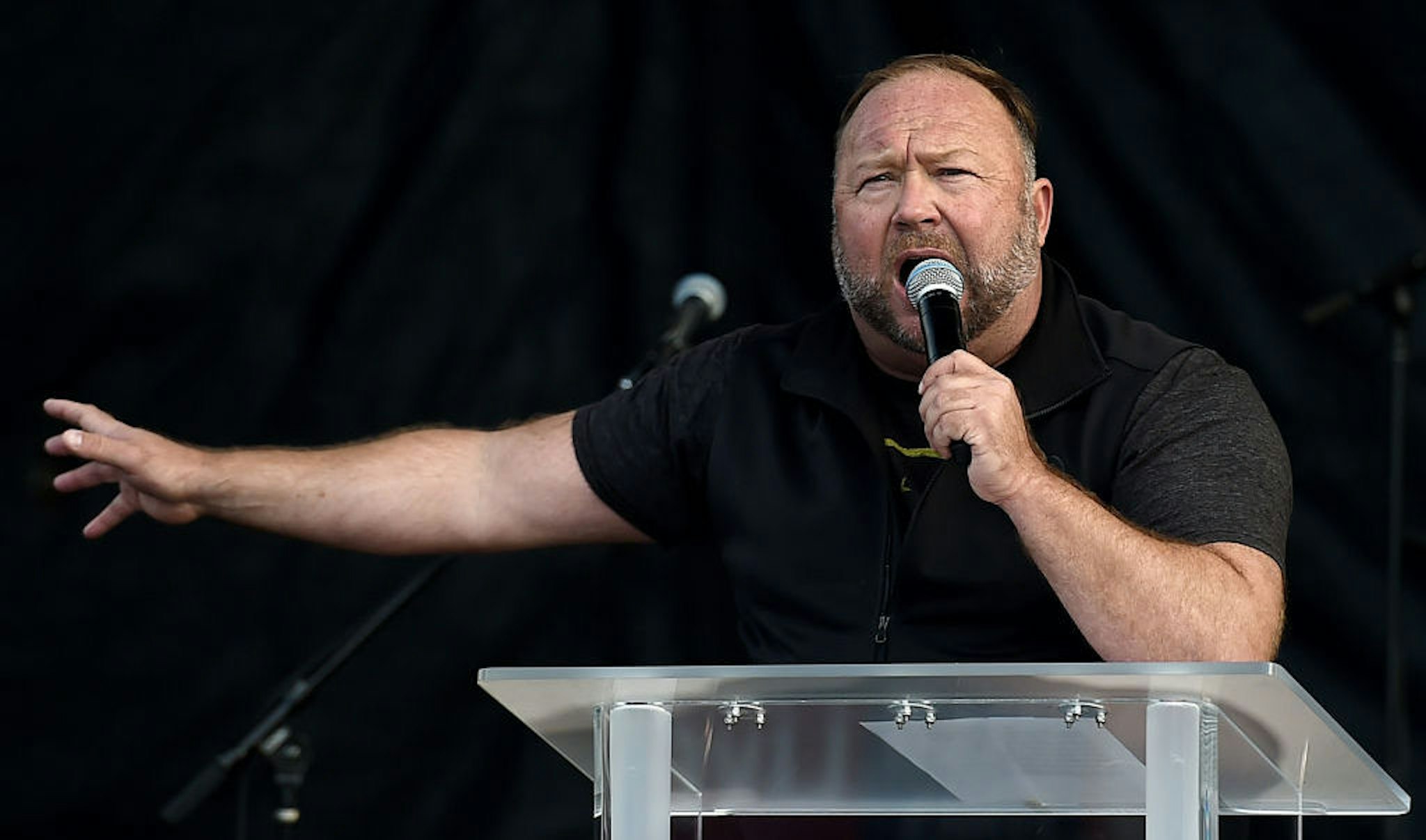 US far-right radio show Alex Jones speaks to supporters of US President Donald Trump as they demonstrate in Washington, DC, on December 12, 2020, to protest the 2020 election. (Photo by Olivier DOULIERY / AFP) (Photo by OLIVIER DOULIERY/AFP via Getty Images)