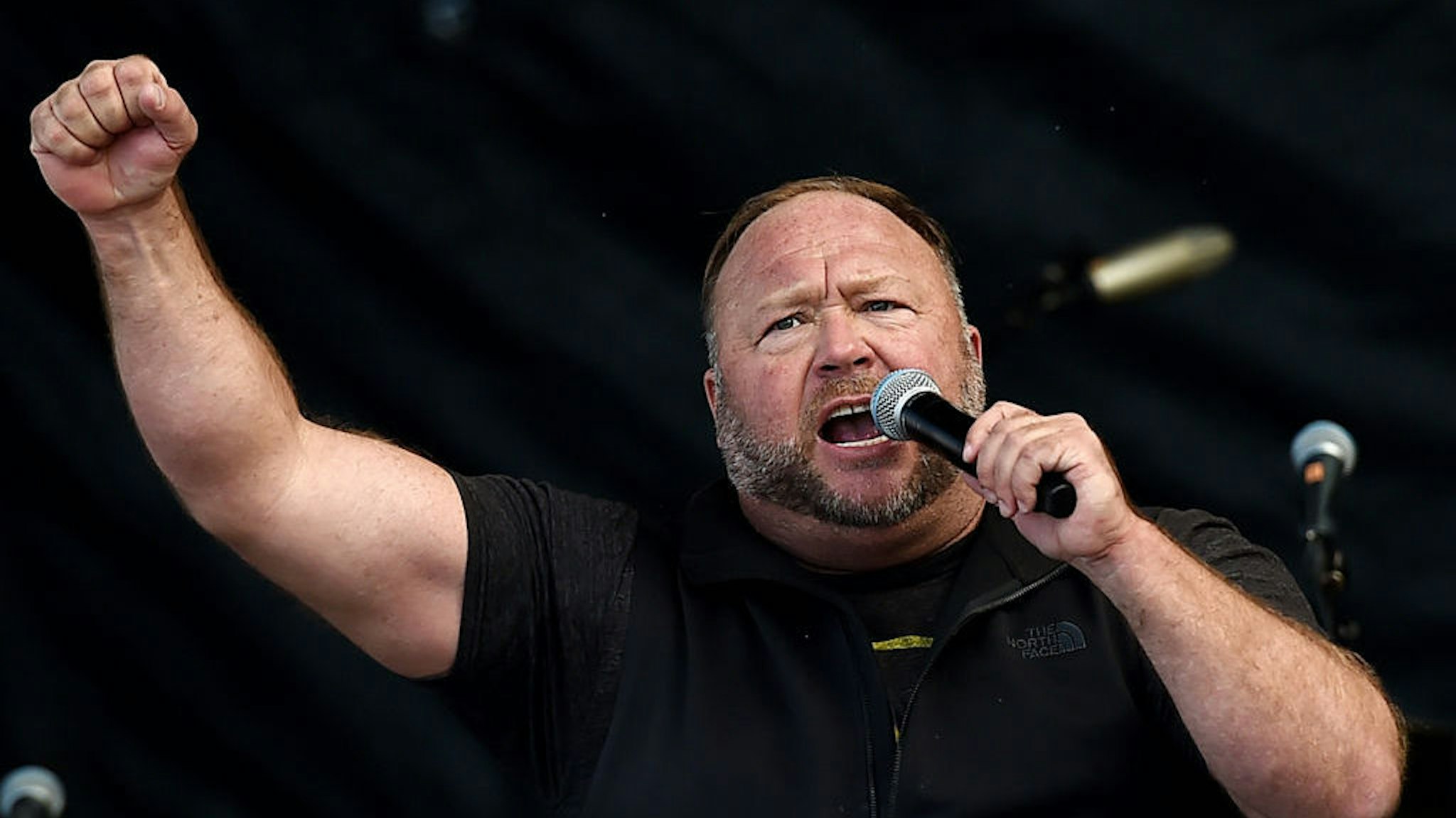 US far-right radio show Alex Jones speaks to supporters of US President Donald Trump as they demonstrate in Washington, DC, on December 12, 2020, to protest the 2020 election. (Photo by Olivier DOULIERY / AFP) (Photo by OLIVIER DOULIERY/AFP via Getty Images)