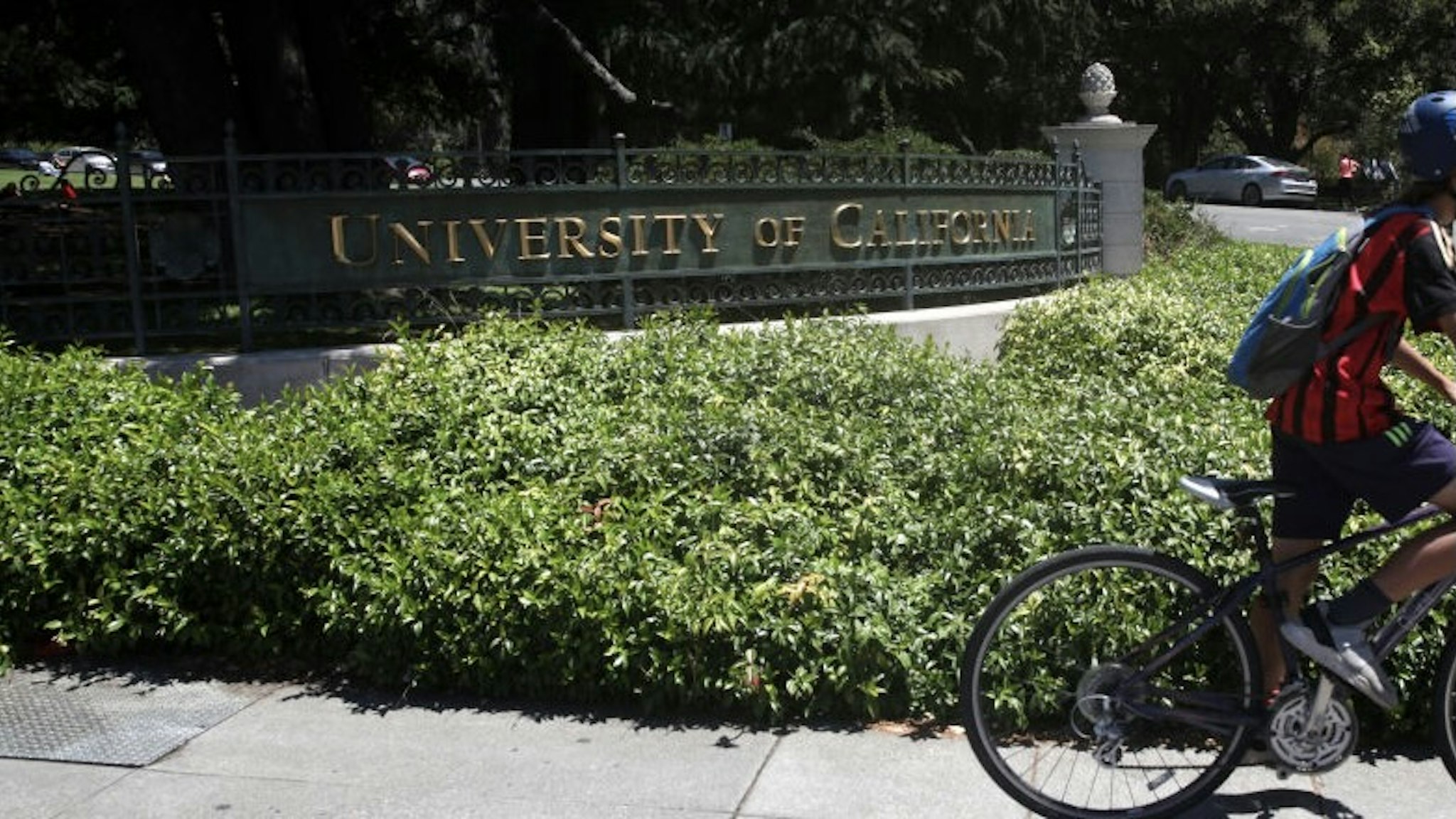 UC Berkeley To Begin Fall Semester With Online-Only Courses BERKELEY, CALIFORNIA - JULY 22: A cyclist rides by a sign in front of the U.C. Berkeley campus on July 22, 2020 in Berkeley, California. U.C. Berkeley announced plans on Tuesday to move to online education for the start of the school's fall semester due to the coronavirus COVID-19 pandemic. (Photo by Justin Sullivan/Getty Images) Justin Sullivan / Staff Photo by Justin Sullivan/Staff/Getty Images via Getty Images