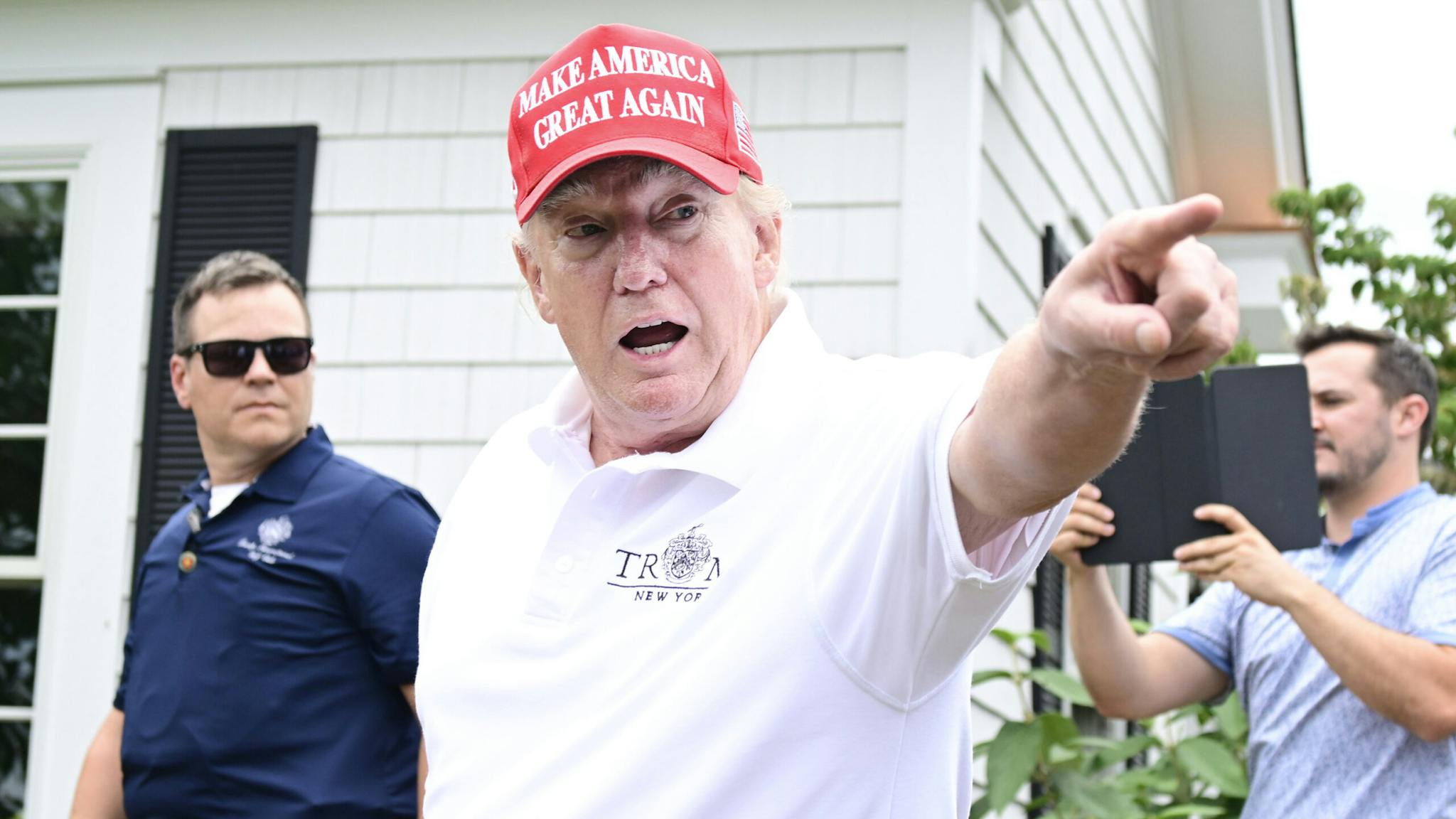 LIV Golf Invitational – Bedminster – Day One BEDMINSTER, NEW JERSEY - JULY 29: Former U.S. President Donald Trump gestures to an attendee during day one of the LIV Golf Invitational - Bedminster at Trump National Golf Club Bedminster on July 29, 2022 in Bedminster, New Jersey.