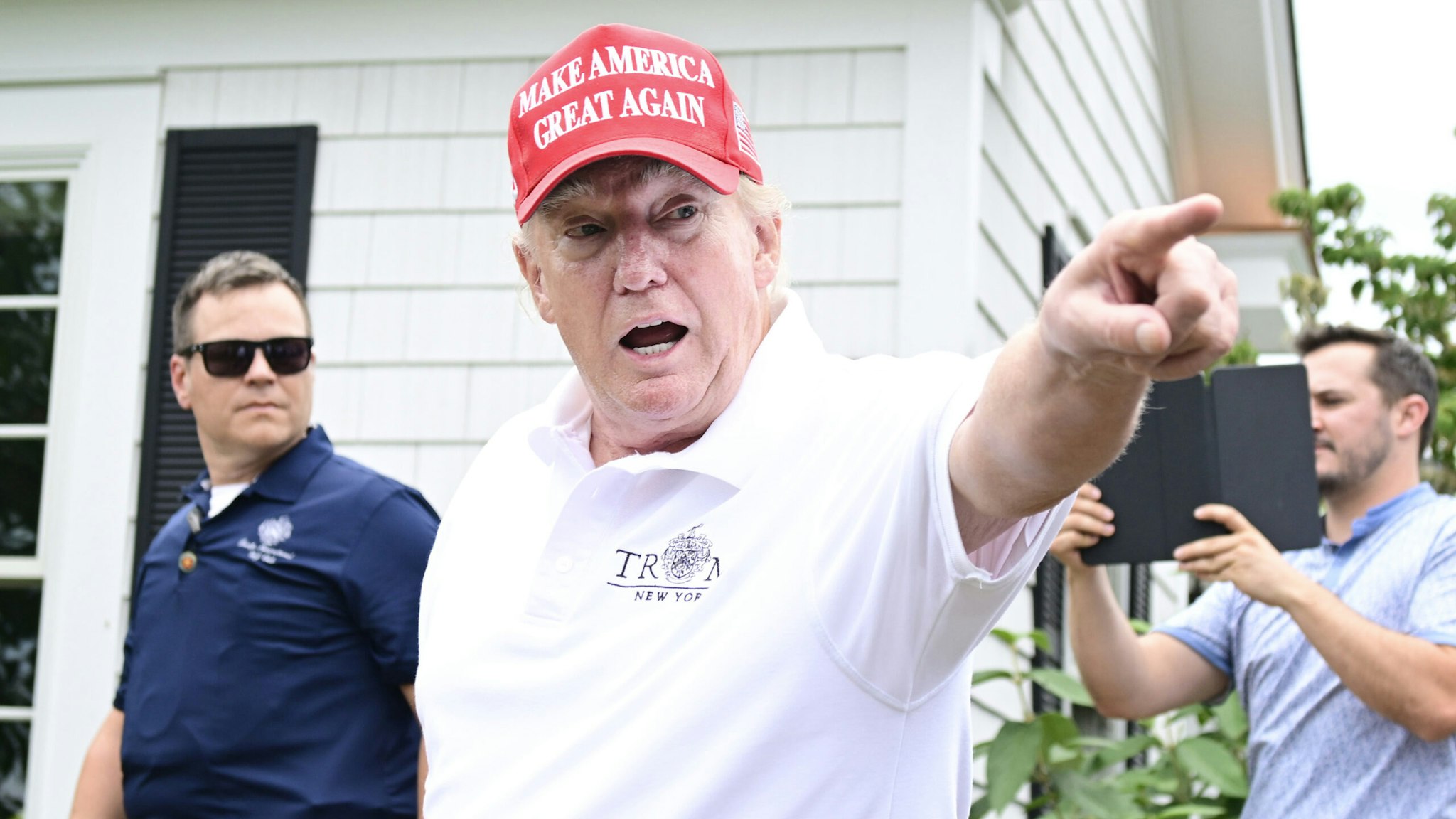 BEDMINSTER, NEW JERSEY - JULY 29: Former U.S. President Donald Trump gestures to an attendee during day one of the LIV Golf Invitational - Bedminster at Trump National Golf Club Bedminster on July 29, 2022 in Bedminster, New Jersey.