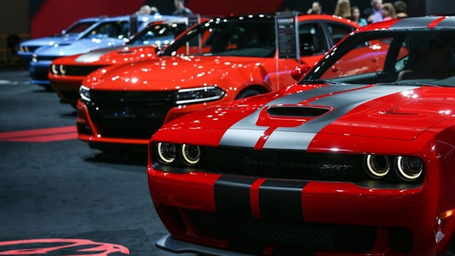 Dodge Challenger (R) and Dodge Charger (L) model cars are on display during the 116th New York International Auto Show at the Javits Convention Center in Manhattan, New York on March 24, 2016.