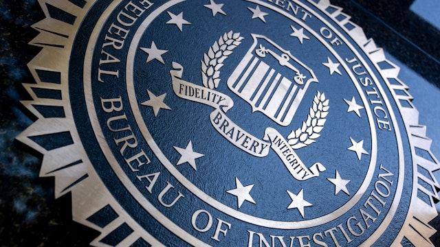 A seal reading "Department of Justice Federal Bureau of Investigation" is displayed on the J. Edgar Hoover FBI building in Washington, DC, o August 9, 2022.
