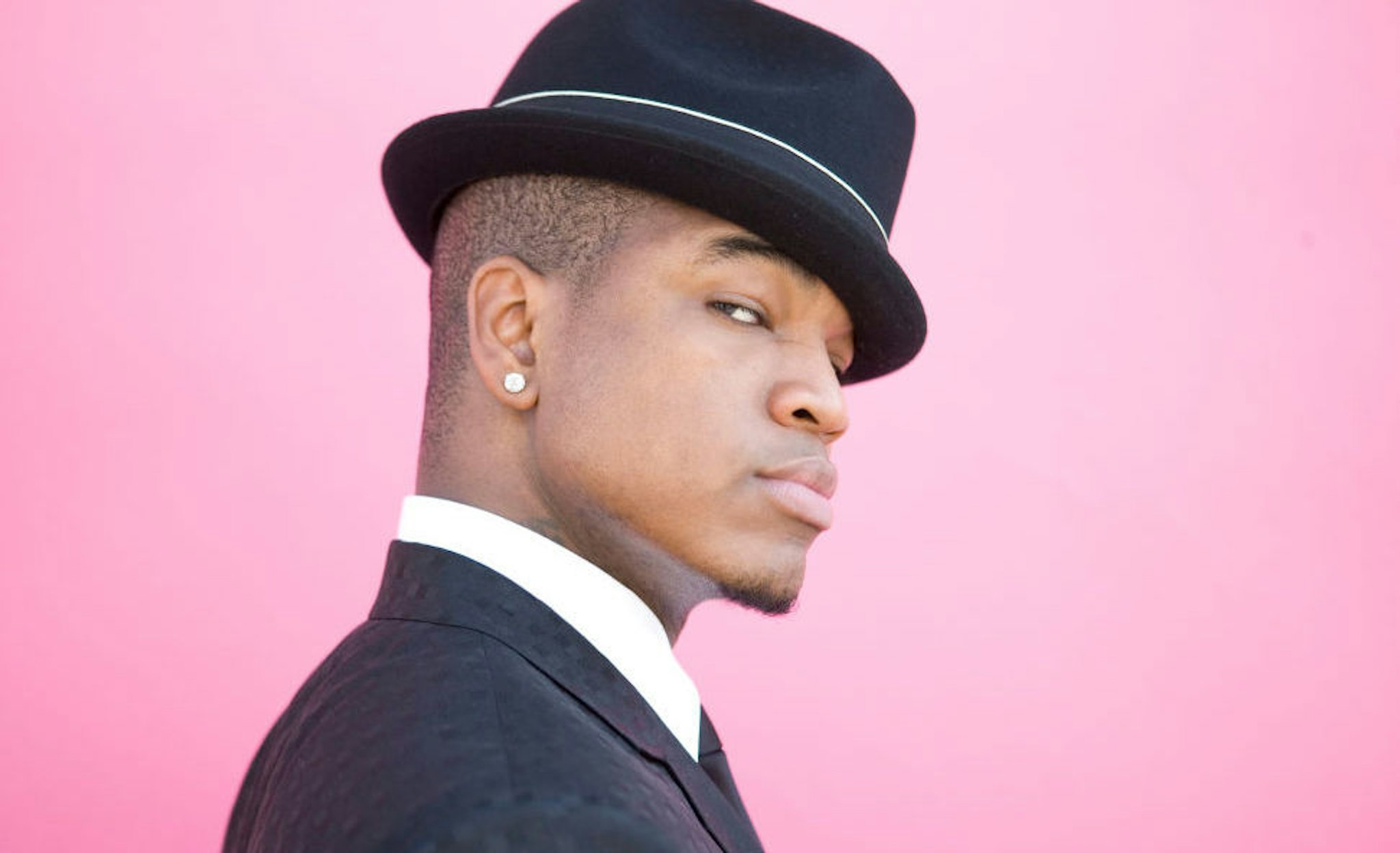 Ne-Yo poses for a portrait with Susie the chimp in Hollywood, California