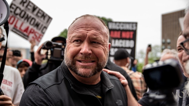 Infowars founder Alex Jones interacts with supporters at the Texas State Capital building on April 18, 2020 in Austin, Texas.