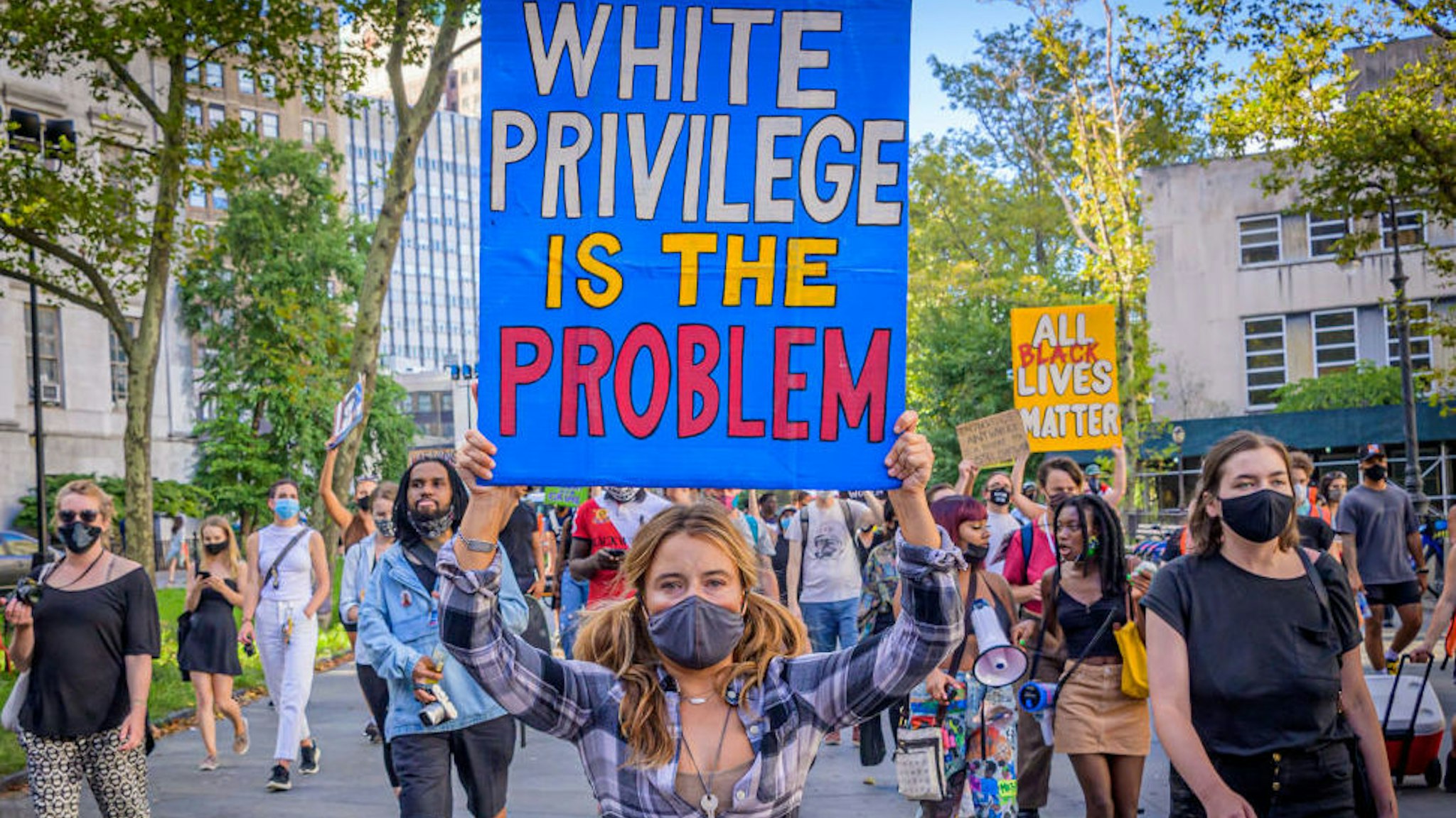 A participant holding a White Privilege Is The Problem sign at the protest. Brooklynites gathered at Cadman Plaza for a march in the streets of Brooklyn, bringing light to Black Women affected by police violence and to amplify the movement against police brutality and racial injustice.