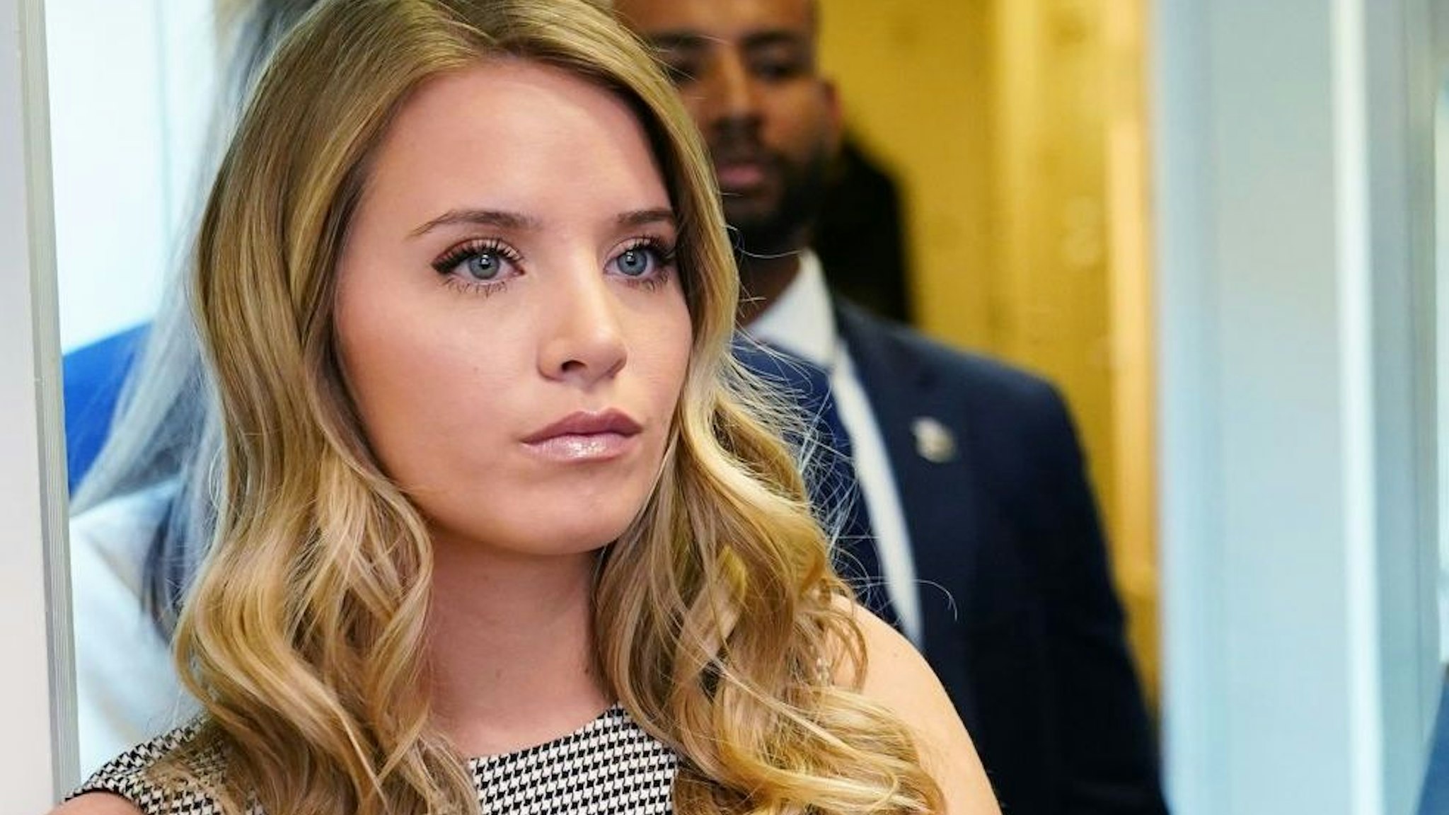 Ryann McEnany, the sister of White House Press Secretary Kayleigh McEnany, watches as her sister speaks during a briefing in the Brady Briefing Room of the White House in Washington, DC on November 20, 2020.