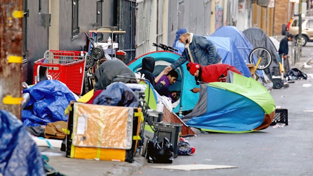 SAN FRANCISCO, CA - FEBRUARY 24: Homeless people consume illegal drugs in an encampment along Willow St. in the Tenderloin district of downtown on Thursday, Feb. 24, 2022 in San Francisco, CA. London Breed, mayor of San Francisco, is the 45th mayor of the City and County of San Francisco. She was supervisor for District 5 and was president of the Board of Supervisors from 2015 to 2018. (Gary Coronado / Los Angeles Times via Getty Images)