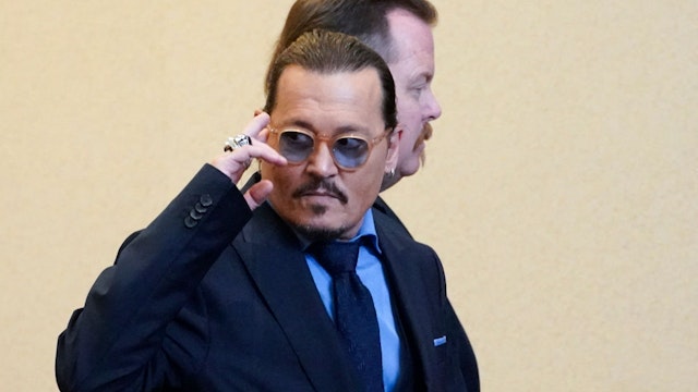 Actor Johnny Depp leaves the courtroom during a break at the Fairfax County Circuit Courthouse in Fairfax, Virginia, on May 27, 2022.