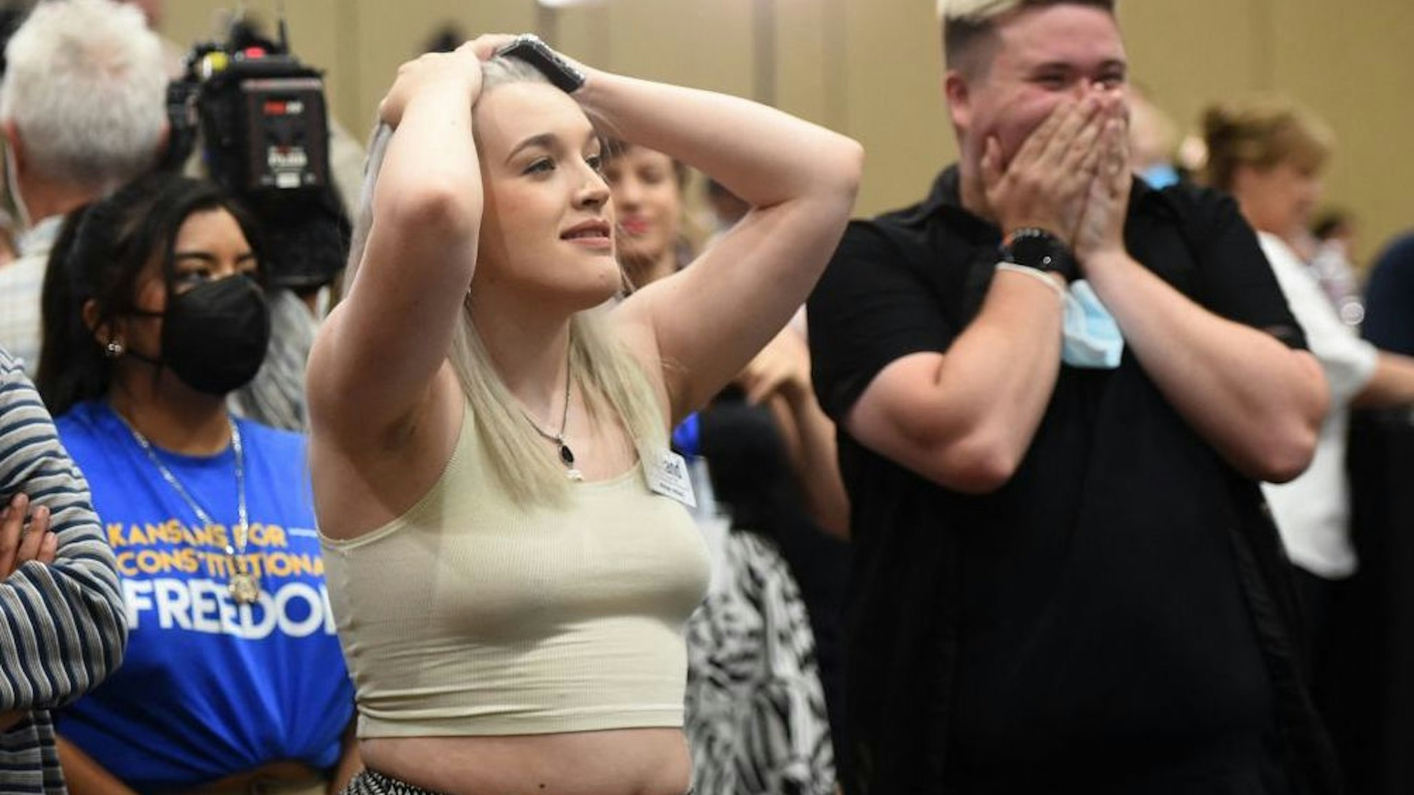Pro-choice supporters Alie Utley and Joe Moyer (R) react to their county voting against the proposed constitutional amendment during the Kansas for Constitutional Freedom primary election watch party in Overland Park, Kansas August 2, 2022.
