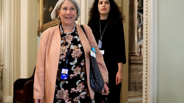 WASHINGTON, DC - JULY 22: Anita Dunn(L), senior advisor to President Joe Biden, and White House Deputy Director of Legislative Affairs Reema Dodin arrive for a lunch meeting with Senate Democrats at the U.S. Capitol on July 22, 2021 in Washington, DC. Dunn and Dodin are meeting with the senators to to help them push back against Republican accusations that the president's Build Back Better agenda is reckless spending. She suggested Democrats highlight the budget's 'child tax credits, lower prescription drug costs, universal pre-school' and as a tax cut for middle class families.