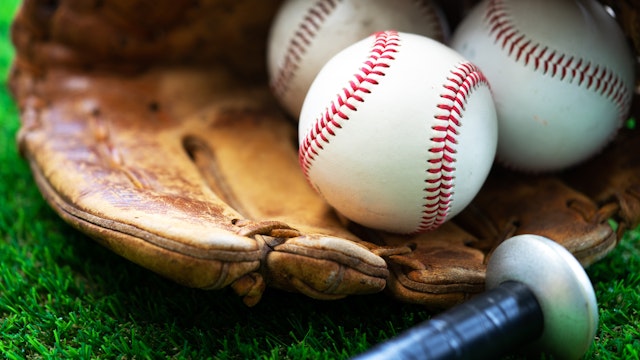 A close up image of baseball,baseball glove,baseball bat