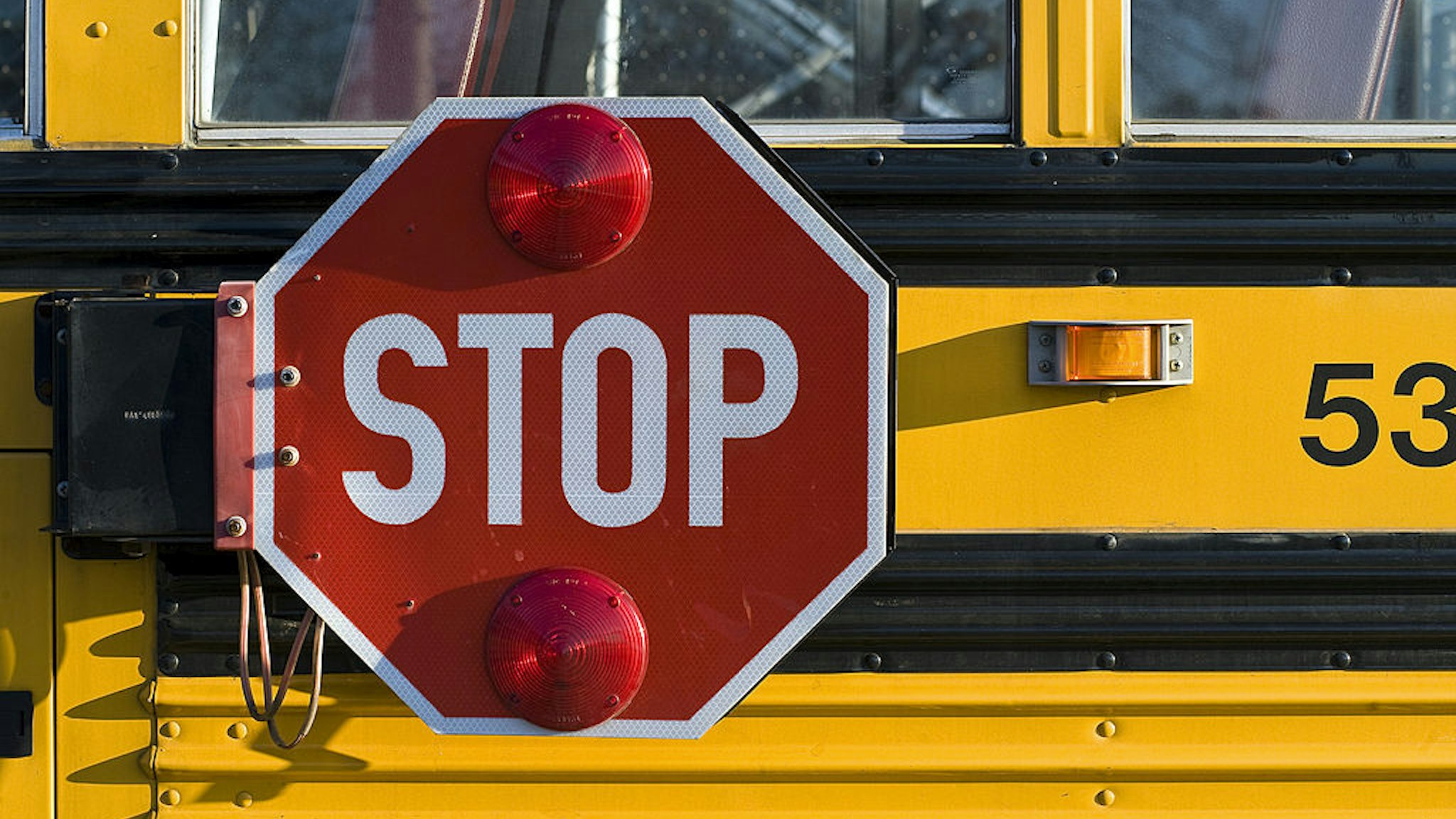 UNITED STATES - 2008/10/27: School bus with retracting safety stop sign. (Photo by John Greim/LightRocket via Getty Images)