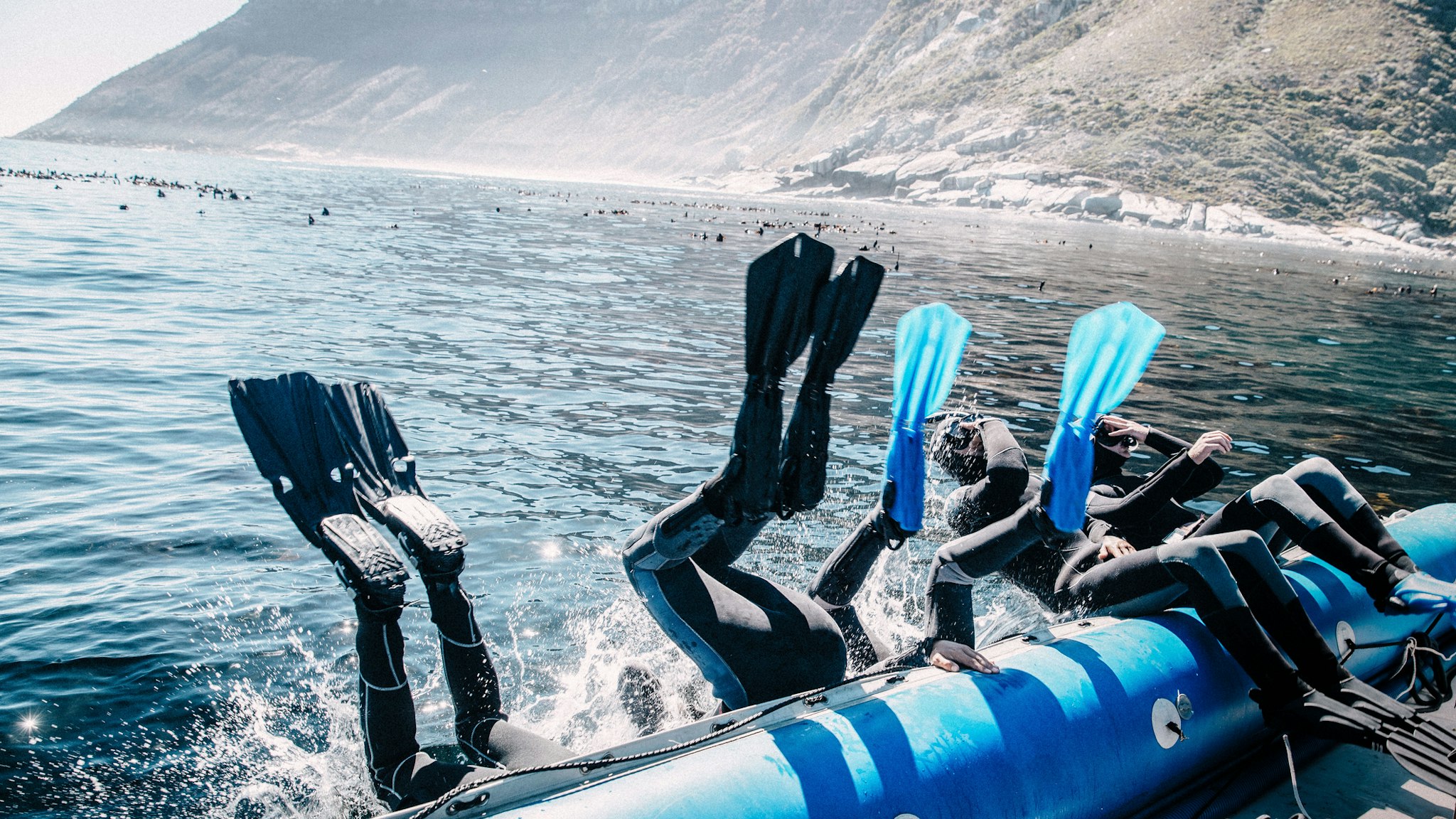 Scuba Divers Diving From Boat