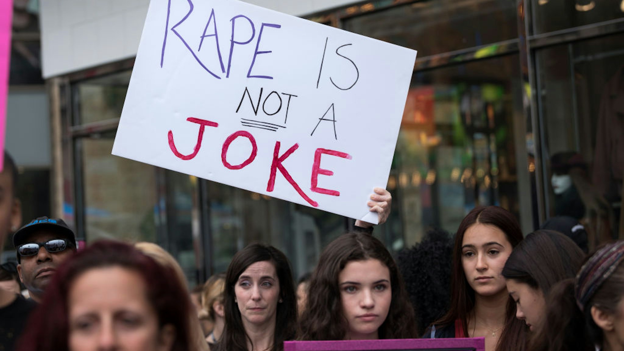 Protesters attend a Me Too rally to denounce sexual harassment and assaults of women in Los Angeles, California on November 12, 2017