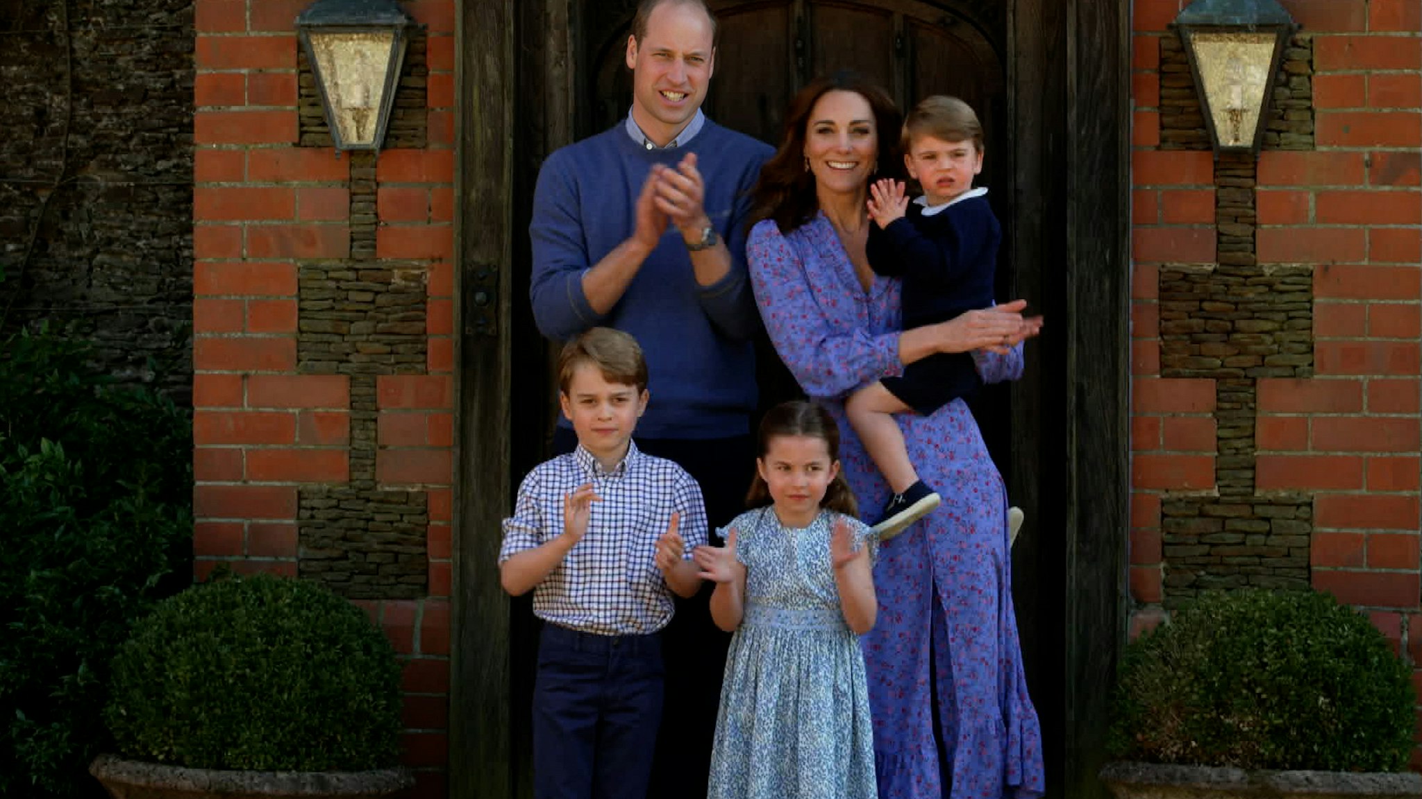 In this screengrab, Prince William, Duke of Cambridge, Catherine Duchess of Cambridge, Prince George of Cambridge, Princess Charlotte of Cambridge and Prince Louis of Cambridge clap for NHS carers as part of the BBC Children In Need and Comic Relief 'Big Night In at London on April 23, 2020 in London, England.
