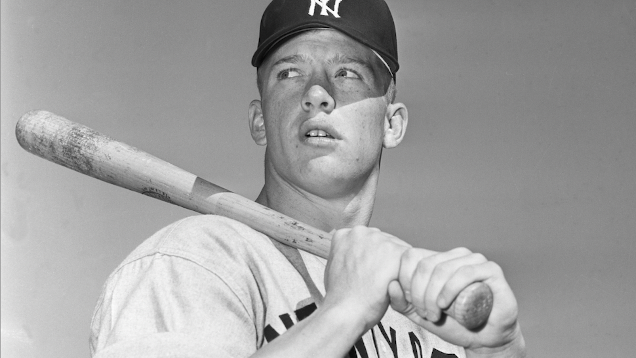 A baseball card from Yankee great Mickey Mantle's rookie year shattered the record when an anonymous buyer paid $12.6 million for it.