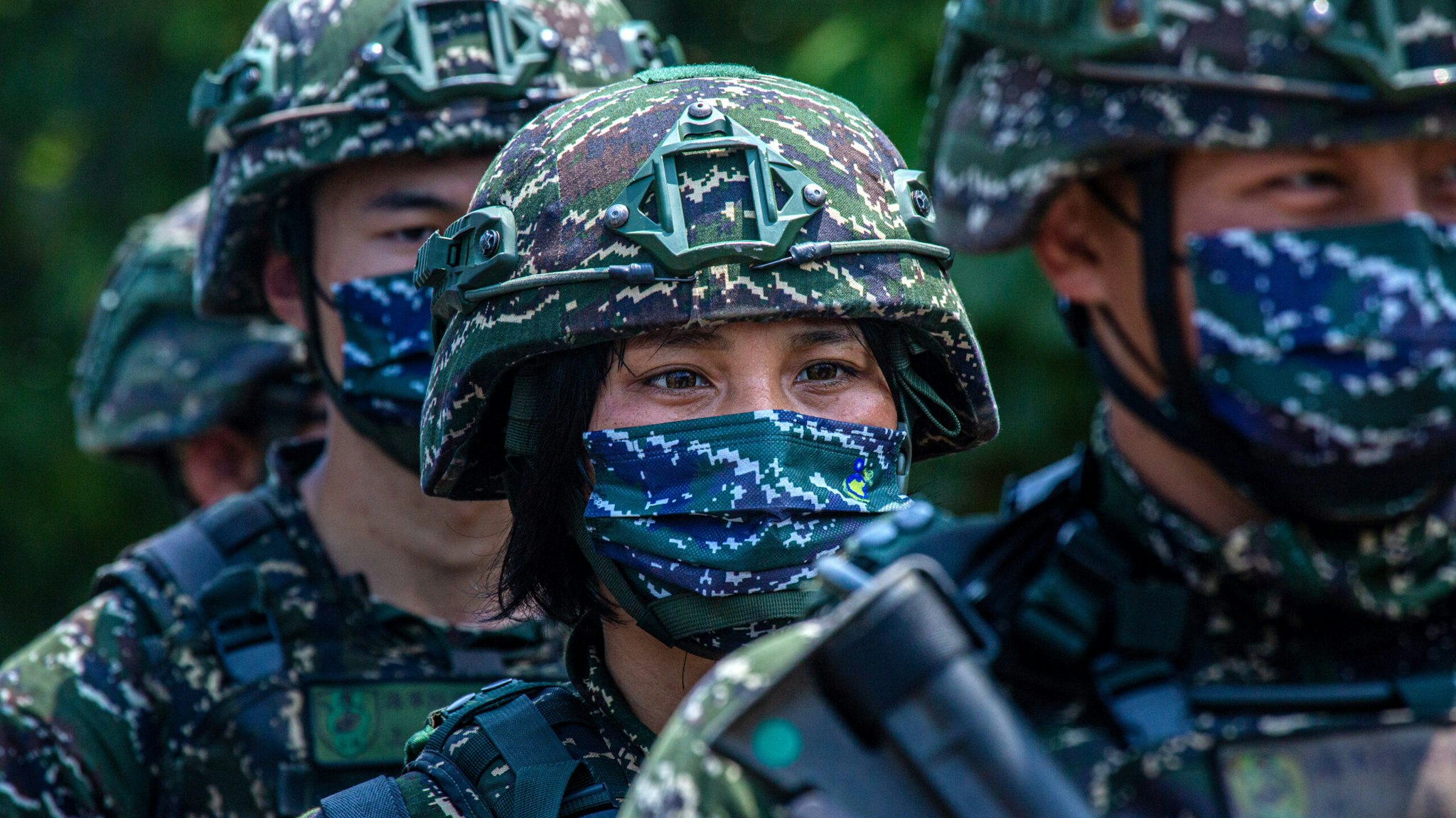 NEW TAIPEI CITY, TAIWAN - JULY 27: Taiwanese military personnel stand in a line during the Han Kuang military exercise, which simulates China's People's Liberation Army (PLA) invading the island on July 27, 2022 in New Taipei City, Taiwan. Taiwan military launches a weeklong of live fire drills involving all forces of the military to repel simulated attacks from China.