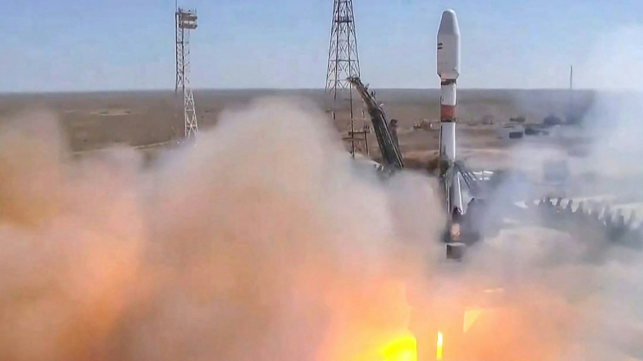 This handout video grab taken and released on August 9, 2022 by the Russian Space Agency Roscosmos shows the Soyuz-2.1b rocket carrying the Khayyam satellite blasting off from a launchpad at the Baikonur Cosmodrome.