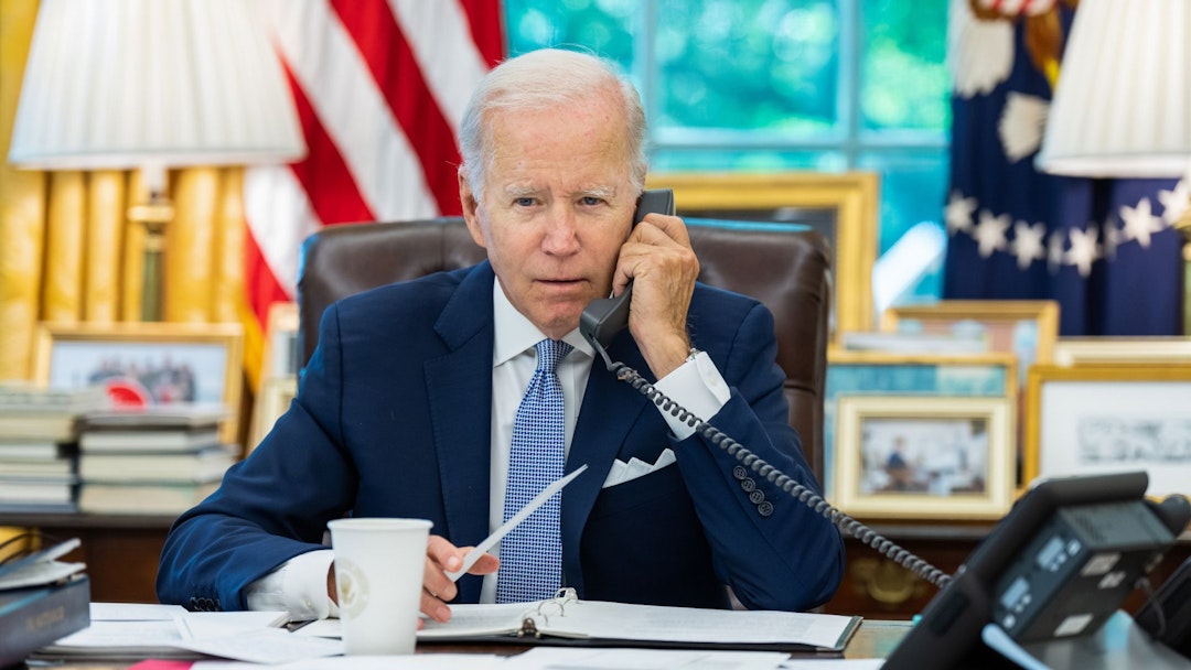 Joe Biden, staring on the phone,