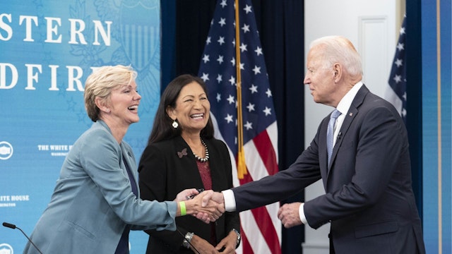 U.S. President Joe Biden, right, greets Jennifer Granholm, U.S. energy secretary, while arriving to a meeting in the Eisenhower Executive Office Building in Washington, D.C., U.S., on Wednesday, June 30, 2021.