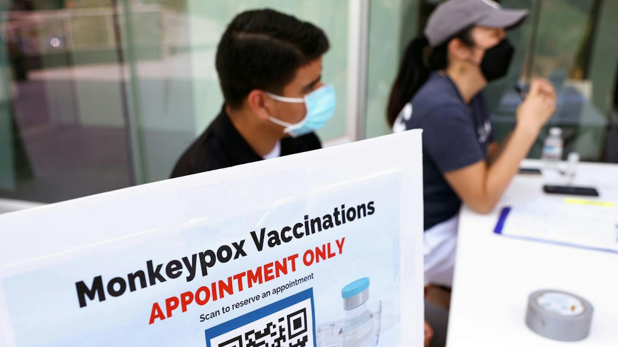 Monkeypox Health workers sit at a check-in table at a pop-up monkeypox vaccination clinic which opened today by the Los Angeles County Department of Public Health at the West Hollywood Library on August 3, 2022 in West Hollywood, California.