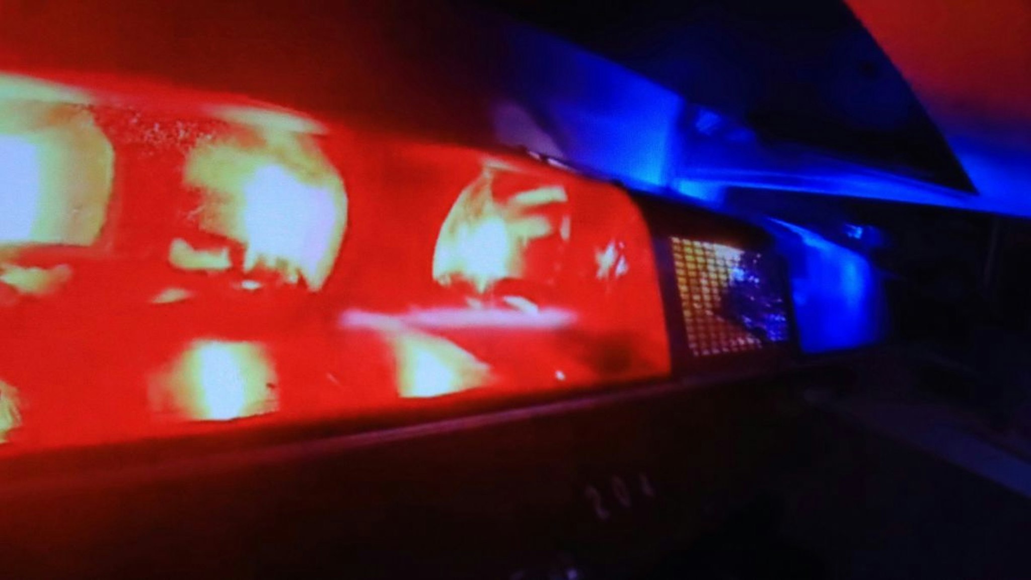 Emergency lights on a police car flashing - stock photo