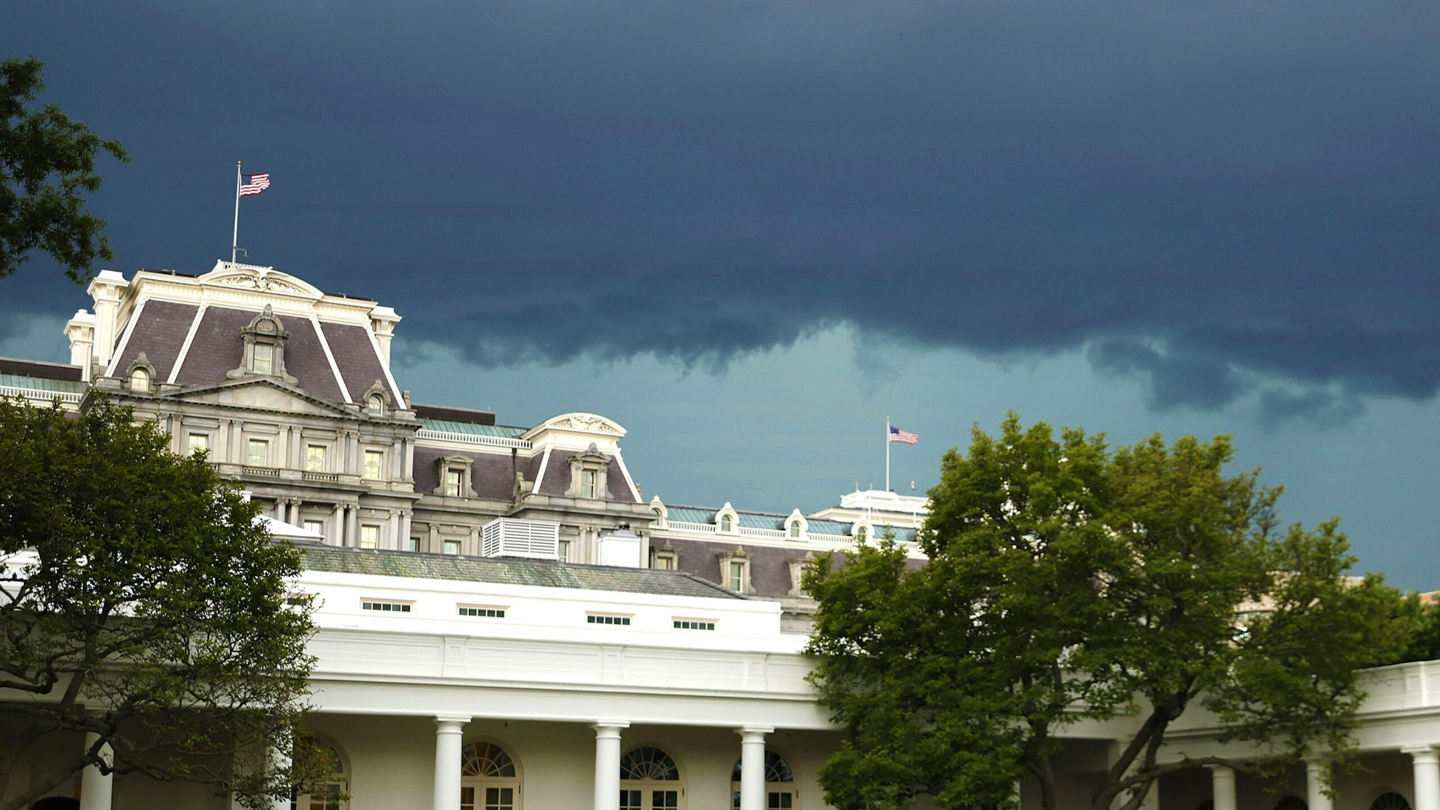 WASHINGTON, DC - JULY 12: Storm clouds roll in over the West Wing of the White House at the conclusion of the Congressional Picnic on July 12, 2022 in Washington, DC. An annual opportunity for members of Congress and their families to visit administration officials and others for non-partisan fellowship and entertainment, the picnic was cancelled in 2020 and 2021 due to the ongoing coronavirus pandemic.