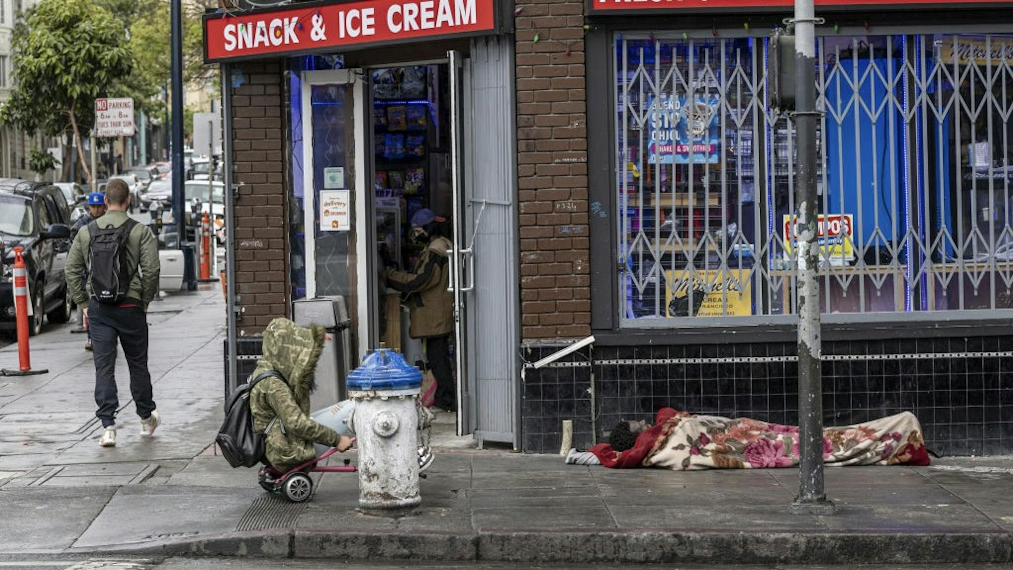 8A98B476-F0DF-46B4-B600-FB6261934236_1_201_a Homelessness Continues To Rise In San Francisco A person experiencing homelessness sleeps on the sidewalk in the Tenderloin district of San Francisco, California, U.S., on Thursday, April, 14, 2022. San Francisco was home to more than 9,800 unhoused people as of the last released count in 2019, up more than 30% from two years earlier, according to a city point-in-time estimate that is likely a significant undercount. Photographer: David Paul Morris/Bloomberg via Getty Images Bloomberg / Contributor