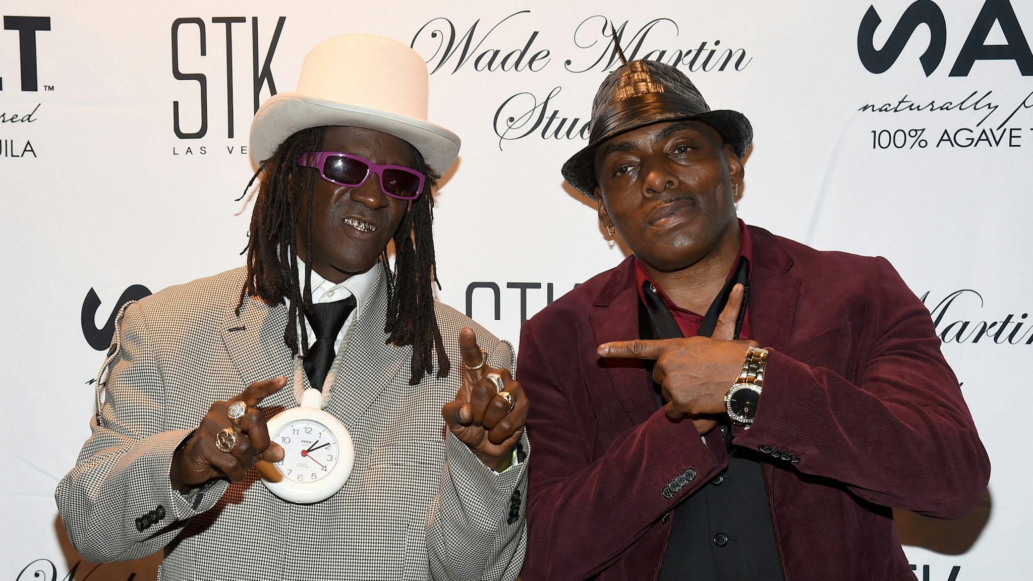 LAS VEGAS, NV - SEPTEMBER 01: Rapper Flavor Flav (L) and rapper/actor Coolio attend producer Wade Martin's premiere of music videos by Flavor Flav and Coolio, the first ever to use full-HD virtual reality technology, at STK at The Cosmopolitan of Las Vegas on September 1, 2015 in Las Vegas, Nevada.