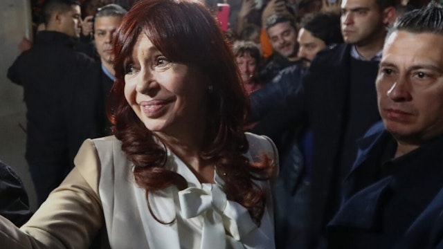 Vice President of Argentina Cristina Fernandez greets supporters as arriving at her apartment in Recoleta neighborhood on August 23, 2022 in Buenos Aires, Argentina
