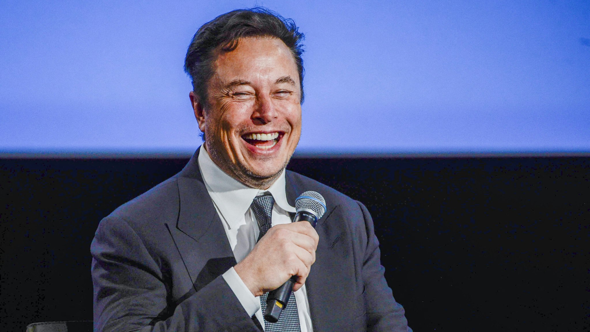 Tesla CEO Elon Musk smiles as he addresses guests at the Offshore Northern Seas 2022 (ONS) meeting in Stavanger, Norway on August 29, 2022. - The meeting, held in Stavanger from August 29 to September 1, 2022, presents the latest developments in Norway and internationally related to the energy, oil and gas sector.