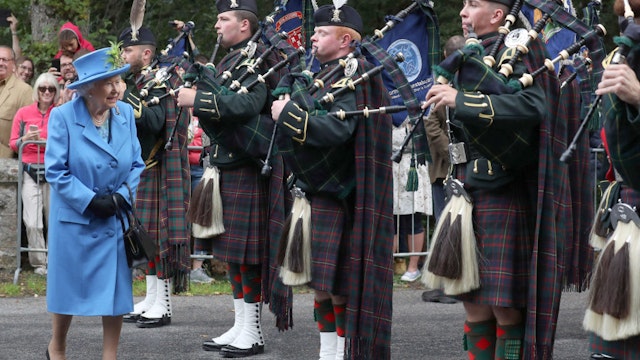 Queen Elizabeth II inspects Pipes and Drums of 4 SCOTS Royal Regiment of Scotland at the gates at Balmoral, as she takes up summer residence at the castle. (Photo by Andrew Milligan/PA Images via Getty Images)