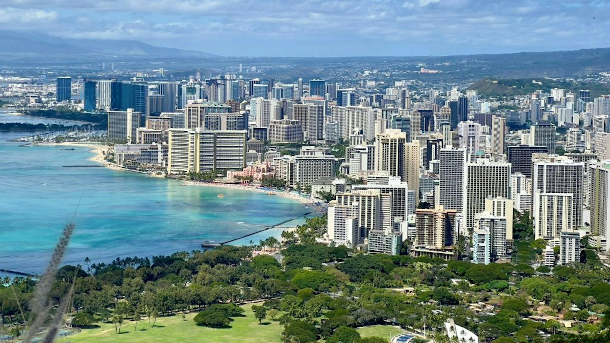 Panoramic view of Waikiki Beach and Honolulu, Hawaii as seen from the Summit of Diamond Head Crater on February 20, 2022.