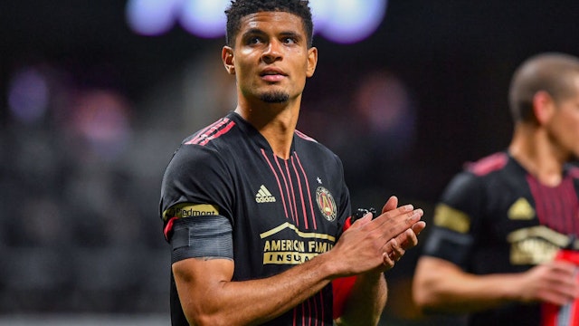 Atlanta defender Miles Robinson (12) thanks the fans following the conclusion of the MLS match between Sporting Kansas City and Atlanta United FC on February 27th, 2022 at Mercedes-Benz Stadium in Atlanta, GA.