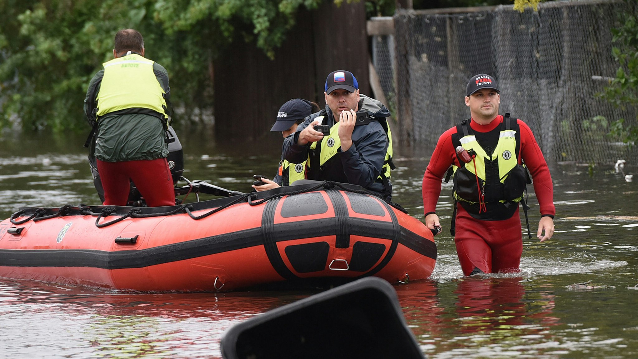 Orange County Fire rescue unit members work in a flooded neighborhood in the aftermath of Hurricane Ian on September 29, 2022 in Orlando, Florida. The storm has caused widespread power outages and flash flooding in Central Florida as it crossed through the state after making landfall in the Fort Myers area as a Category 4 hurricane.