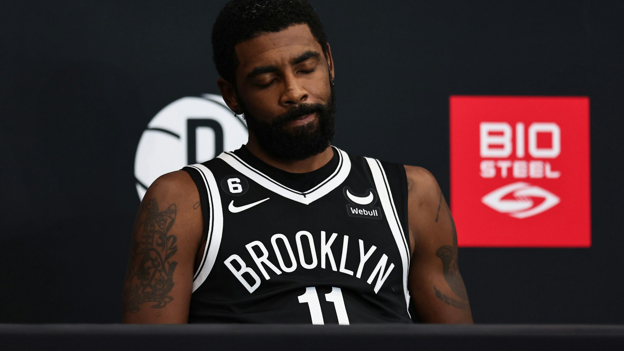 Kyrie Irving #11 of the Brooklyn Nets speaks during a press conference at Brooklyn Nets Media Day at HSS Training Center on September 26, 2022 in the Brooklyn borough of New York City. NOTE TO USER: User expressly acknowledges and agrees that, by downloading and/or using this photograph, User is consenting to the terms and conditions of the Getty Images License Agreement.