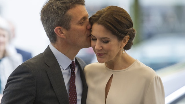 Crown Prince Frederik kisses his wife Crown Princess Mary Of Denmark as they arrive at a furniture shop during their visit to Germany on May 21, 2015 in Munich, Germany.