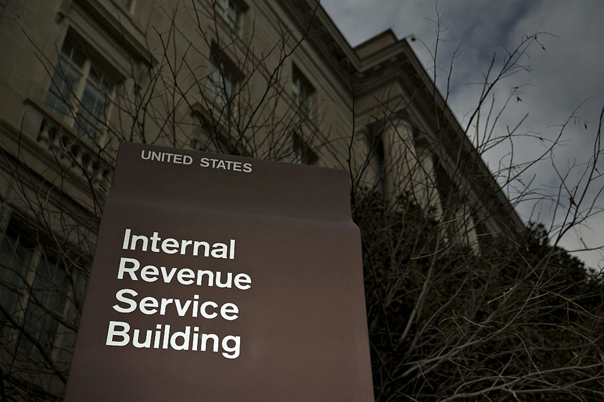 Signage for the Internal Revenue Service (IRS) stands outside the IRS headquarters building in Washington, D.C., U.S., on Wednesday, Feb. 17, 2016. Taxpayers have until Monday, April 18 to file their 2015 tax returns and pay any tax owed.