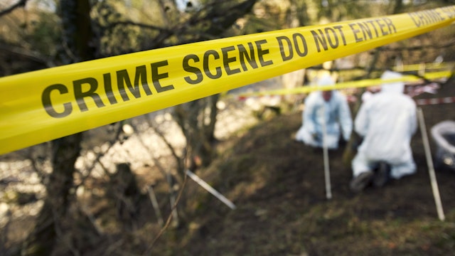 Crime - Scene Investigators Searching Grave Site - stock photo