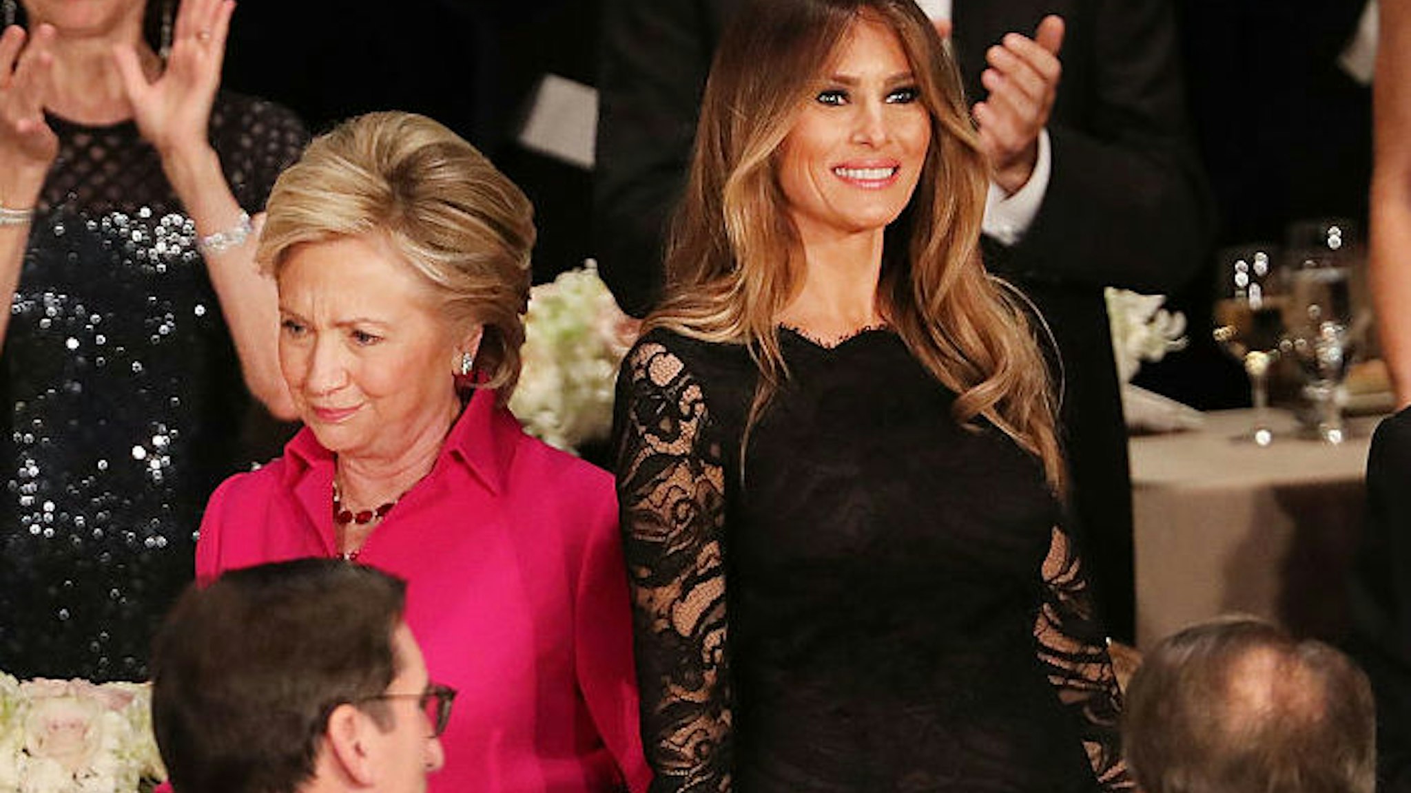Hillary Clinton walks by Melania Trump while attending the annual Alfred E. Smith Memorial Foundation Dinner at the Waldorf Astoria on October 20, 2016 in New York City.