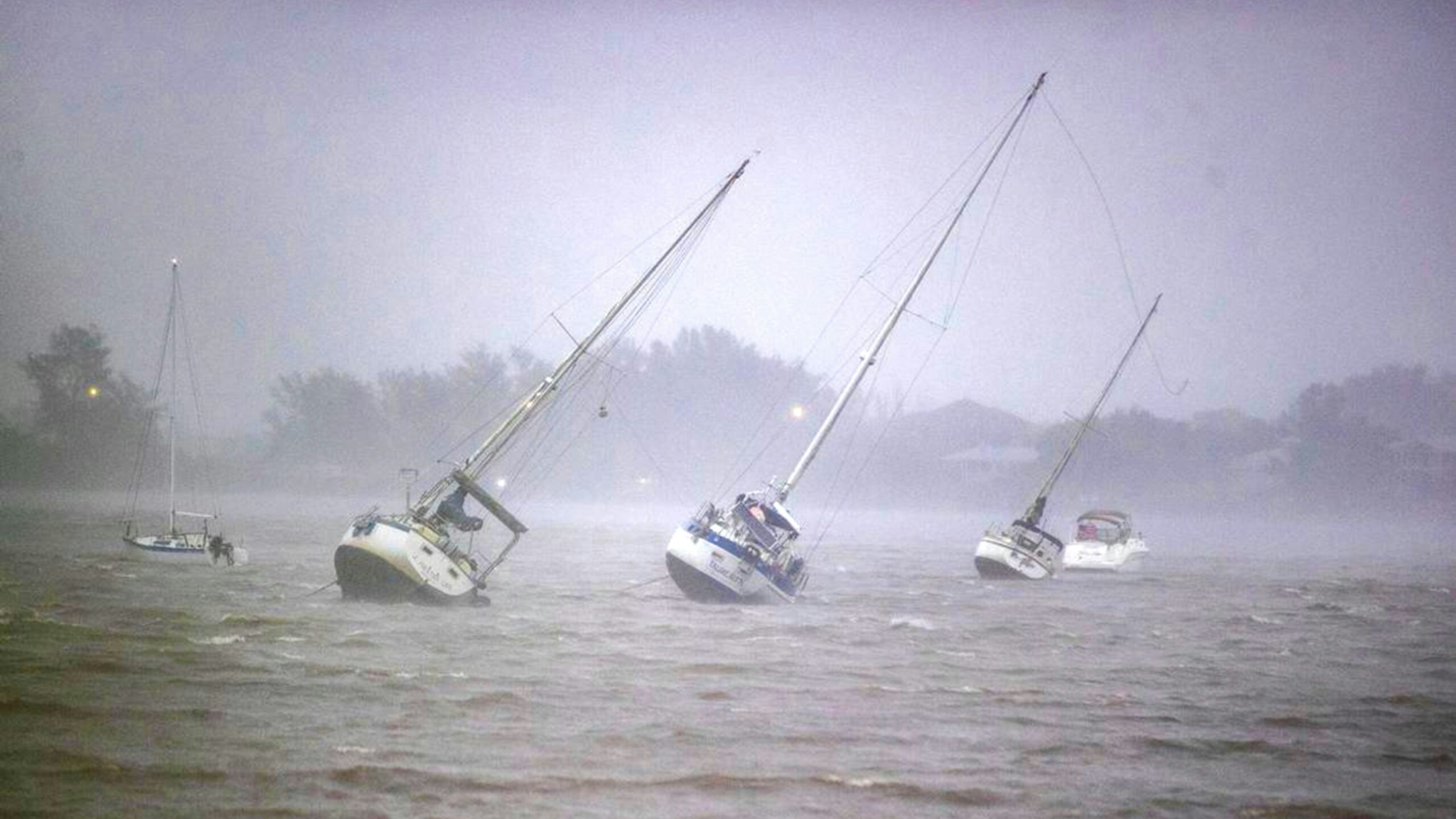 Sail boats anchored in Roberts Bay are blown around by 50 mph winds in Venice, Florida, as Hurricane Ian, a possible Category 5 Hurricane, approaches the West Coast of Florida, on Wednesday, Sept. 28, 2022.