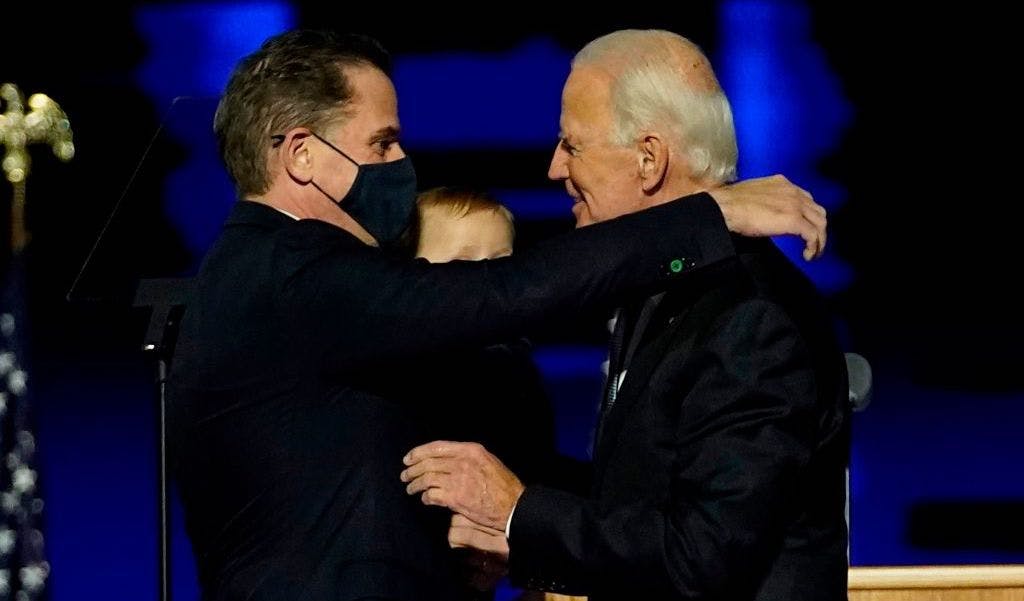WILMINGTON, DELAWARE - NOVEMBER 07: President-elect Joe Biden embraces his son Hunter Biden after addressing the nation from the Chase Center November 07, 2020 in Wilmington, Delaware. After four days of counting the high volume of mail-in ballots in key battleground states due to the coronavirus pandemic, the race was called for Biden after a contentious election battle against incumbent Republican President Donald Trump. (Photo by Andrew Harnik-Pool/Getty Images)