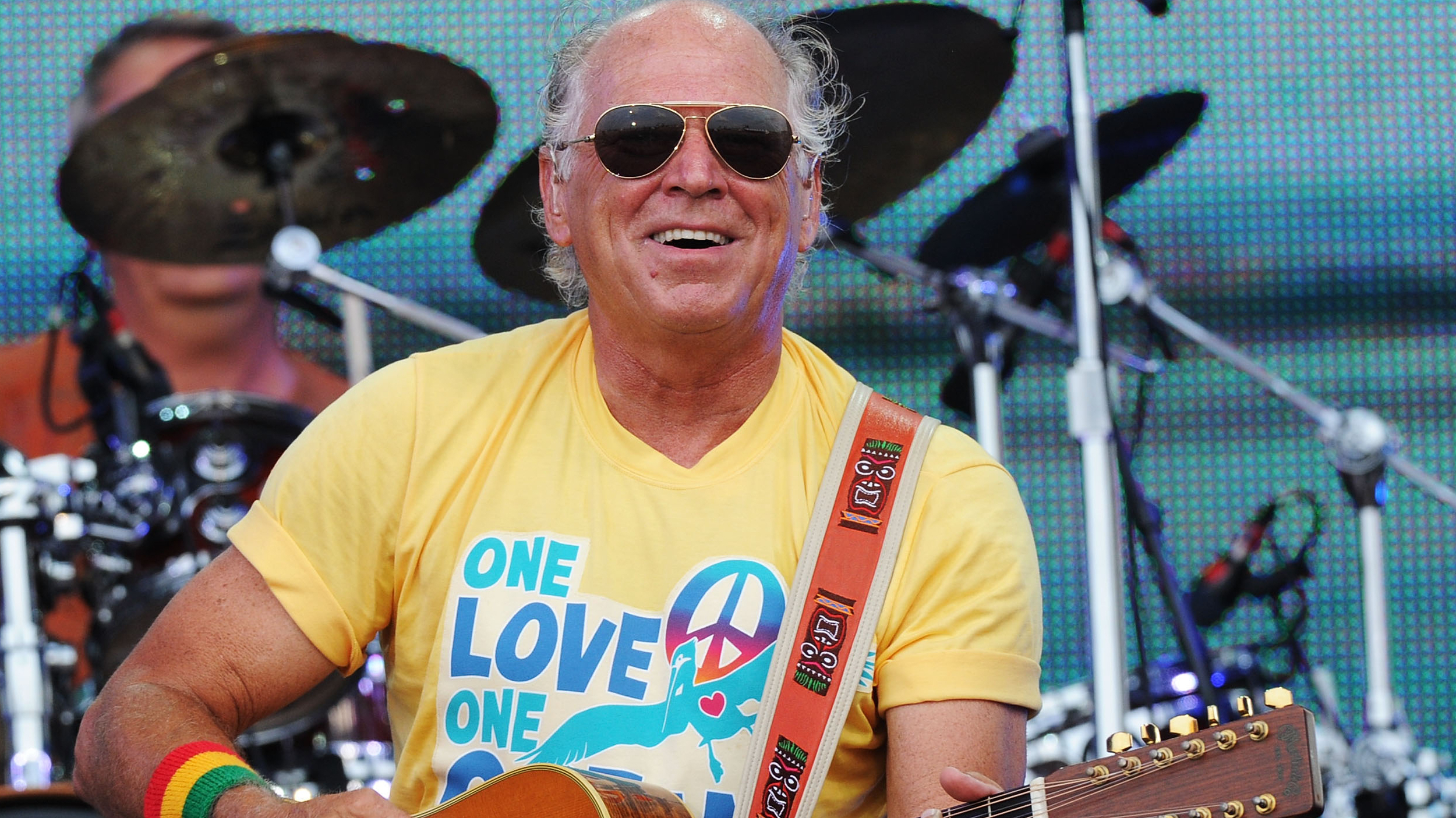 Jimmy Buffett hospitalized, concert postponed due to urgent medical issue.