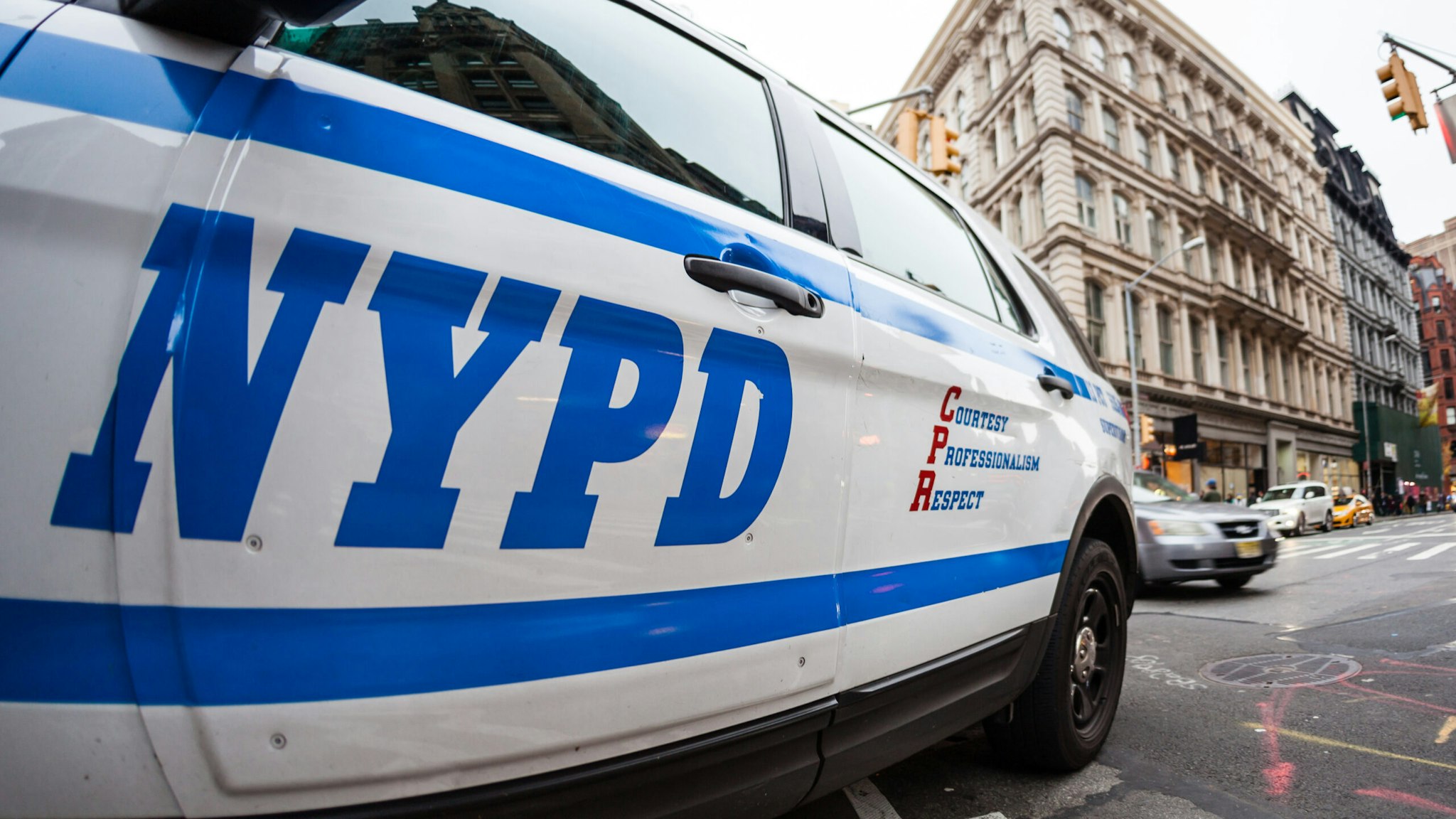 Close up of the NYPD logo on a police car.