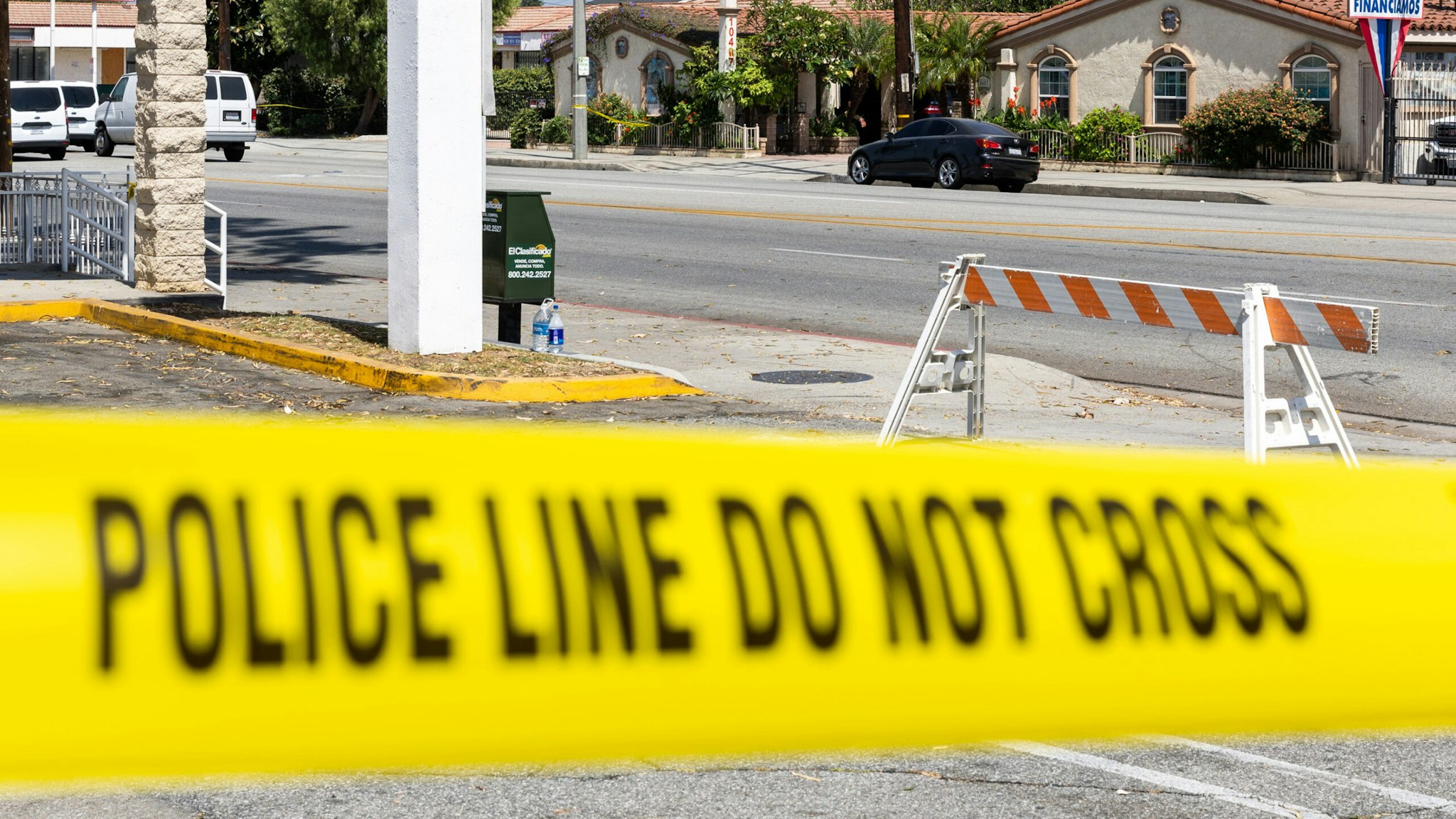 EL MONTE, CA - June 15: Police tape blocks off the scene of a shooting on Tuesday night that left two El Monte police officers dead at Siesta Inn Motel on June 15, 2022 in El Monte, CA.