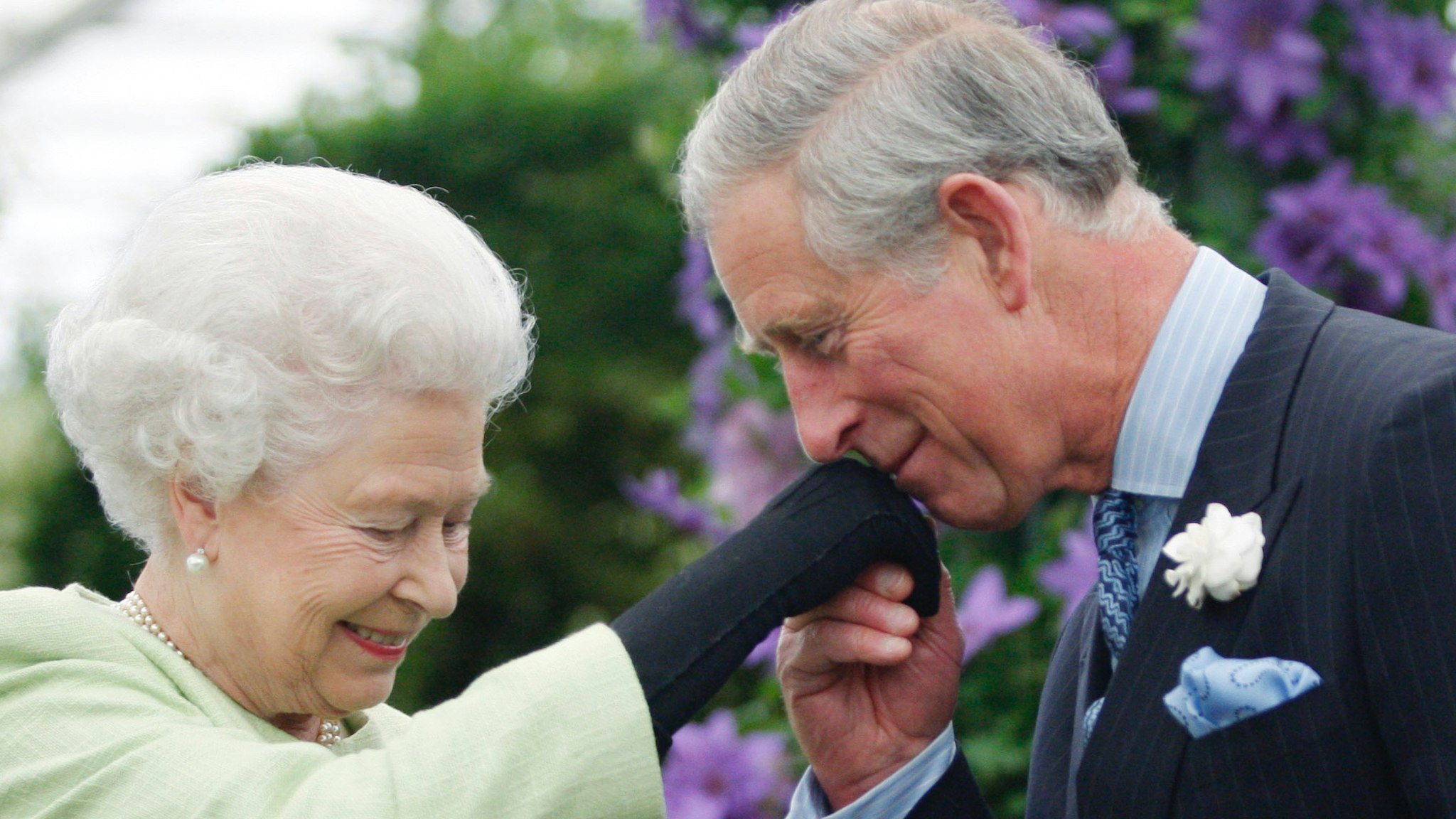 Queen Elizabeth II presents Prince Charles, Prince of Wales with the Royal Horticultural Society's Victoria Medal of Honour during a visit to the Chelsea Flower Show on May 18, 2009 in London.