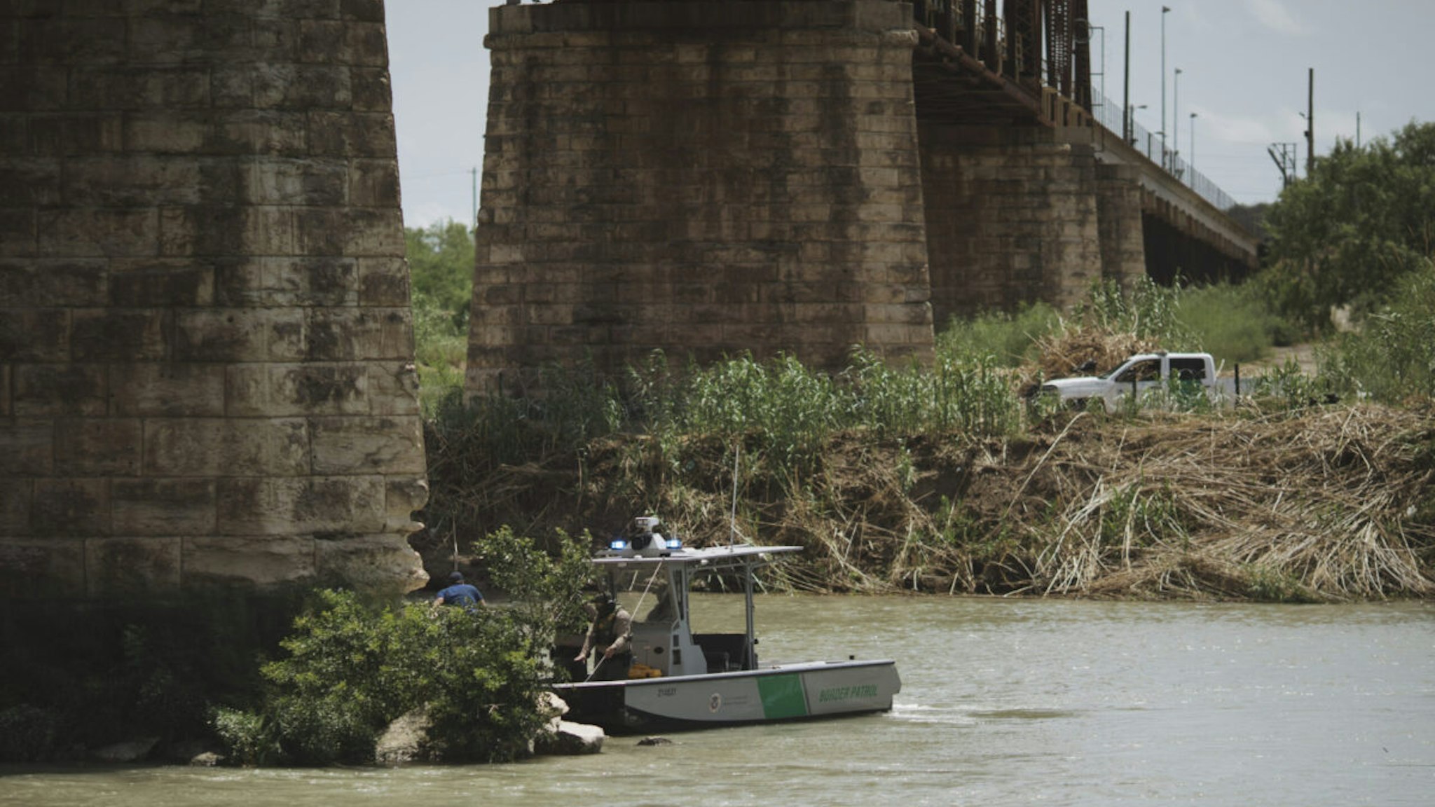 US Border Patrol agents perform a rescue along the Rio Grande River in Eagle Pass, Texas, US, on Tuesday, May 24, 2022
