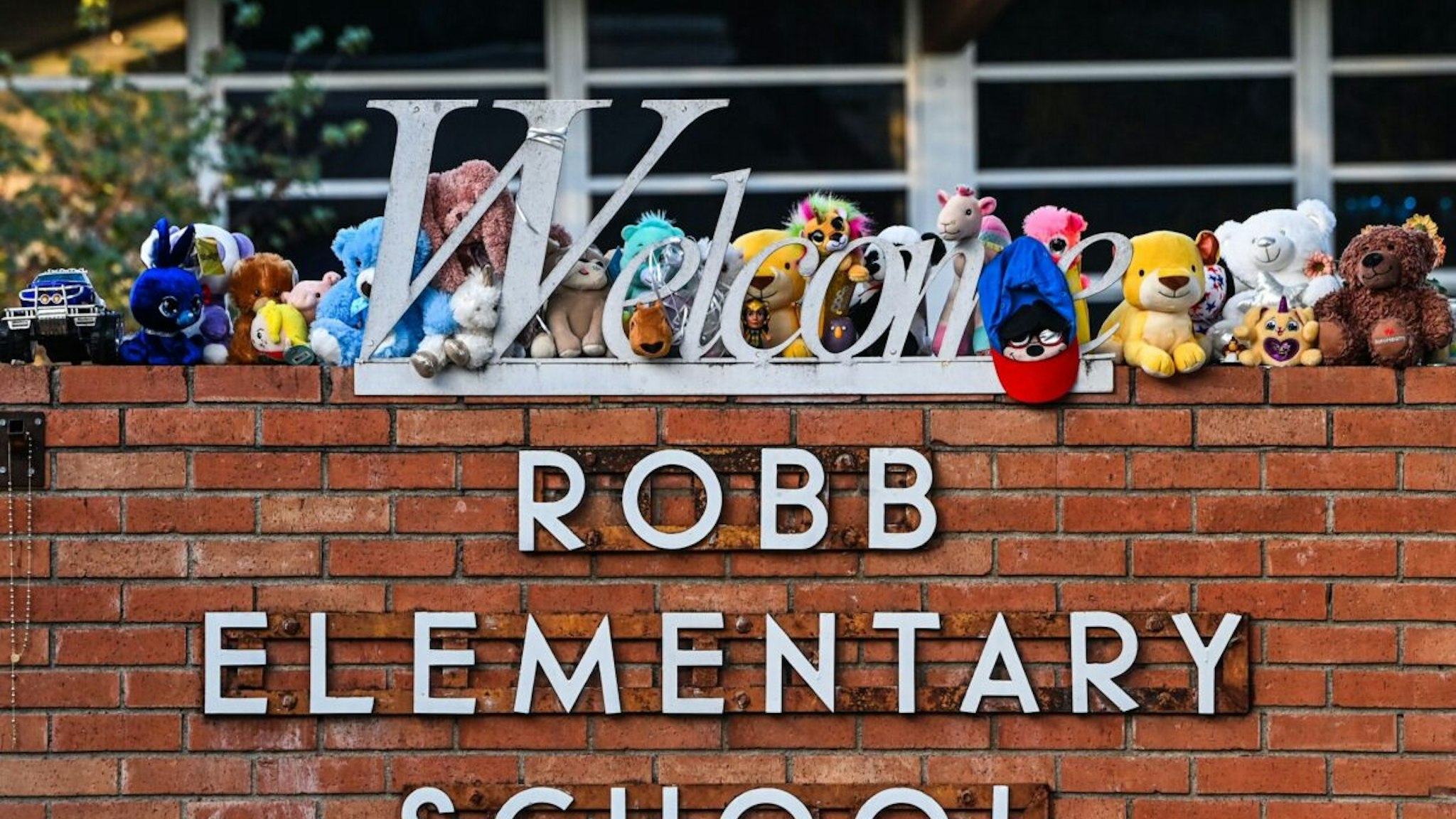 Mementos decorate a makeshift memorial for the shooting victims outside Robb Elementary School in Uvalde, Texas, on May 28, 2022